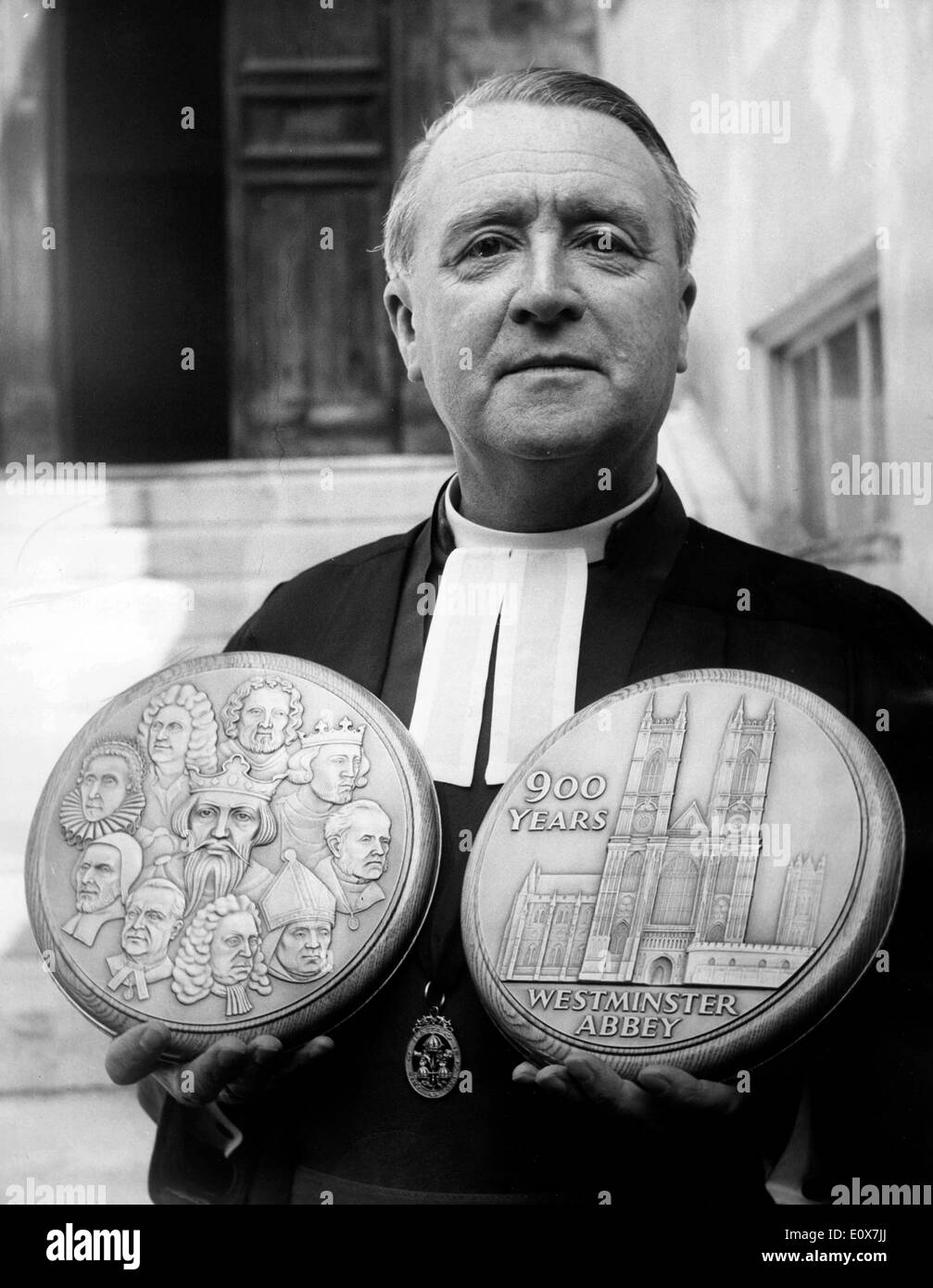 Priest Eric Abbott holds Westminster Abbey medals Stock Photo