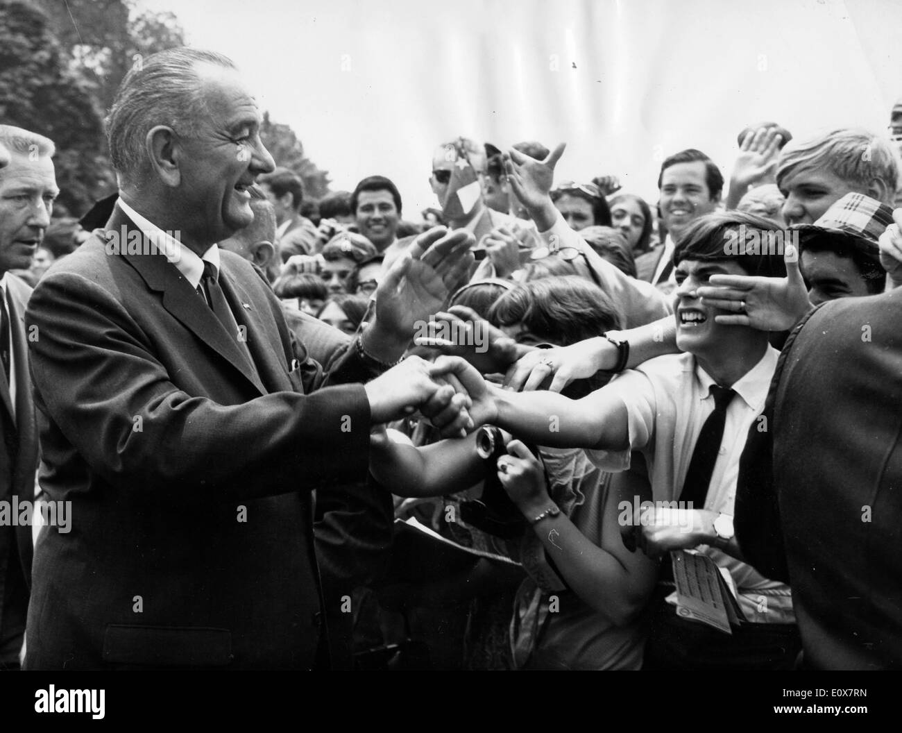 President Johnson shakes hands with students Stock Photo