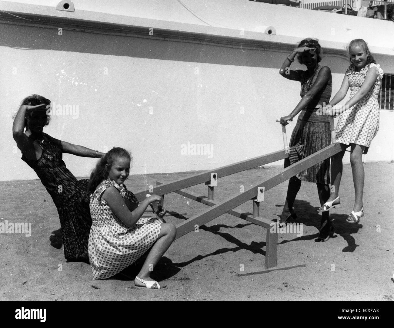 Kessler Twins ALICE KESSLER and ELLEN KESSLER young play on a see saw