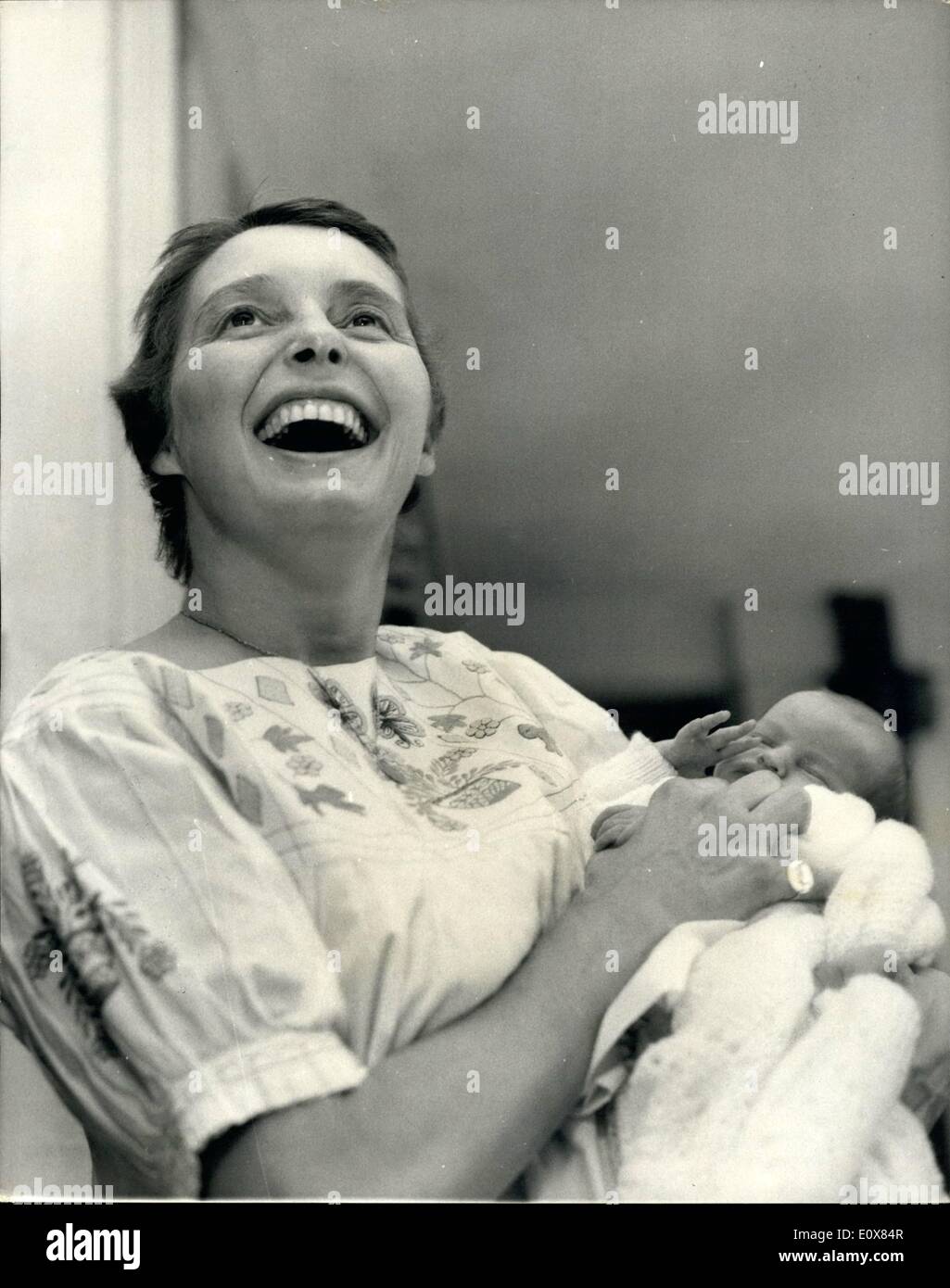 Aug. 08, 1965 - Patricia Neal Leaves Hospital with Her Newly Born Daughter.: Patrica Neal the American actress who lives in Britain, with her husband who is author Mr. Roald Dahl, and her three other children, left the Nuffield Maternity home , Oxford this afternoon with the latest daughter to the family born last week. Pat Neal suffered a series of near-fatal strokes last February while living in America. Photo shows Pat Neal seen  the Maternity home baby daughter Lucy. Stock Photo