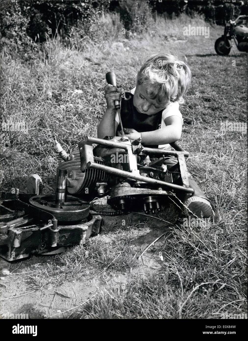 Aug. 08, 1965 - He's speed crazy at five year old: Five year old Keir Doe can often be seen rearing through the garden of his home at 30 mph on a miniature motorcycle made by his father. Keir, who also has a miniature stock car, is no stranger to the racing world. He is often seen by the crowds at Wimbledon Speedway Stadium, Surrey, when he rides his motorcycle or miniature car around the track between races. But for all this Keir, who lives at Bristow Crescent, Camberley, finds that being only five can be a bit of a nuisance Stock Photo