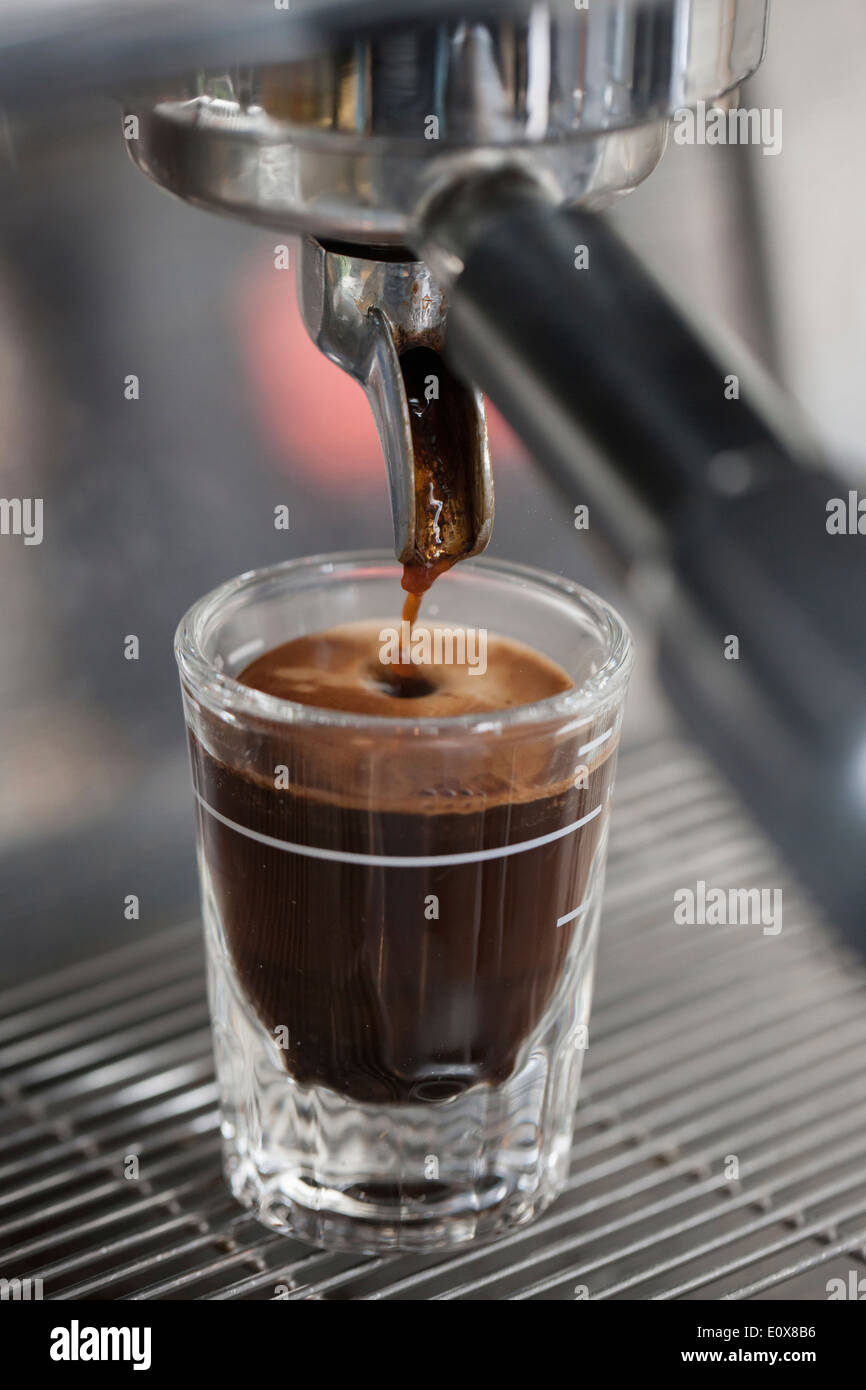 a espresso machine making espresso into a glass Stock Photo Alamy