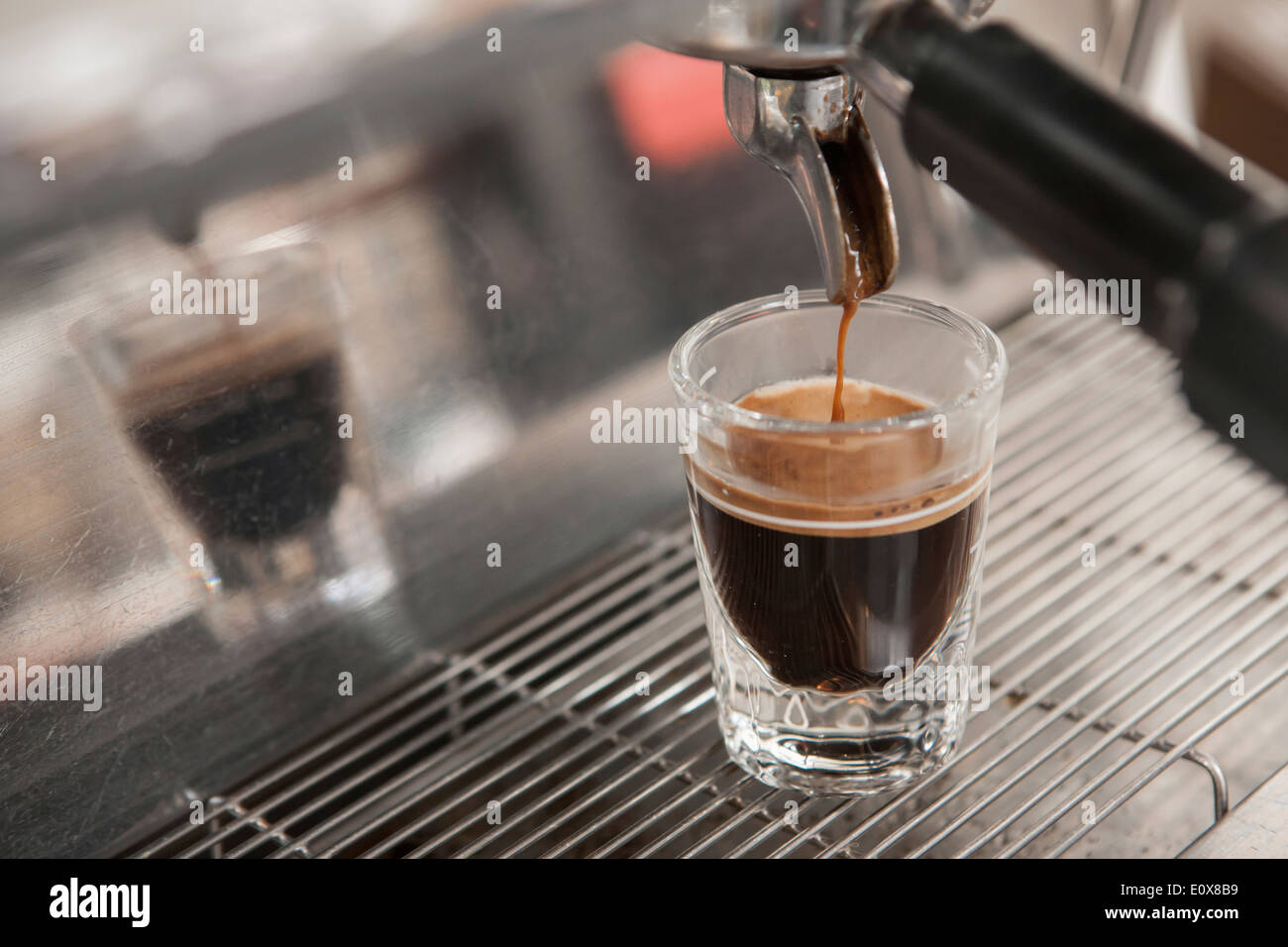 a espresso machine making espresso into a glass Stock Photo Alamy
