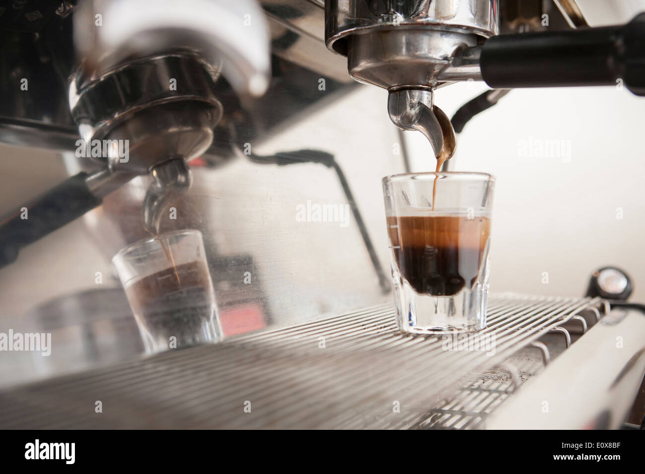 a espresso machine making espresso into a glass Stock Photo Alamy