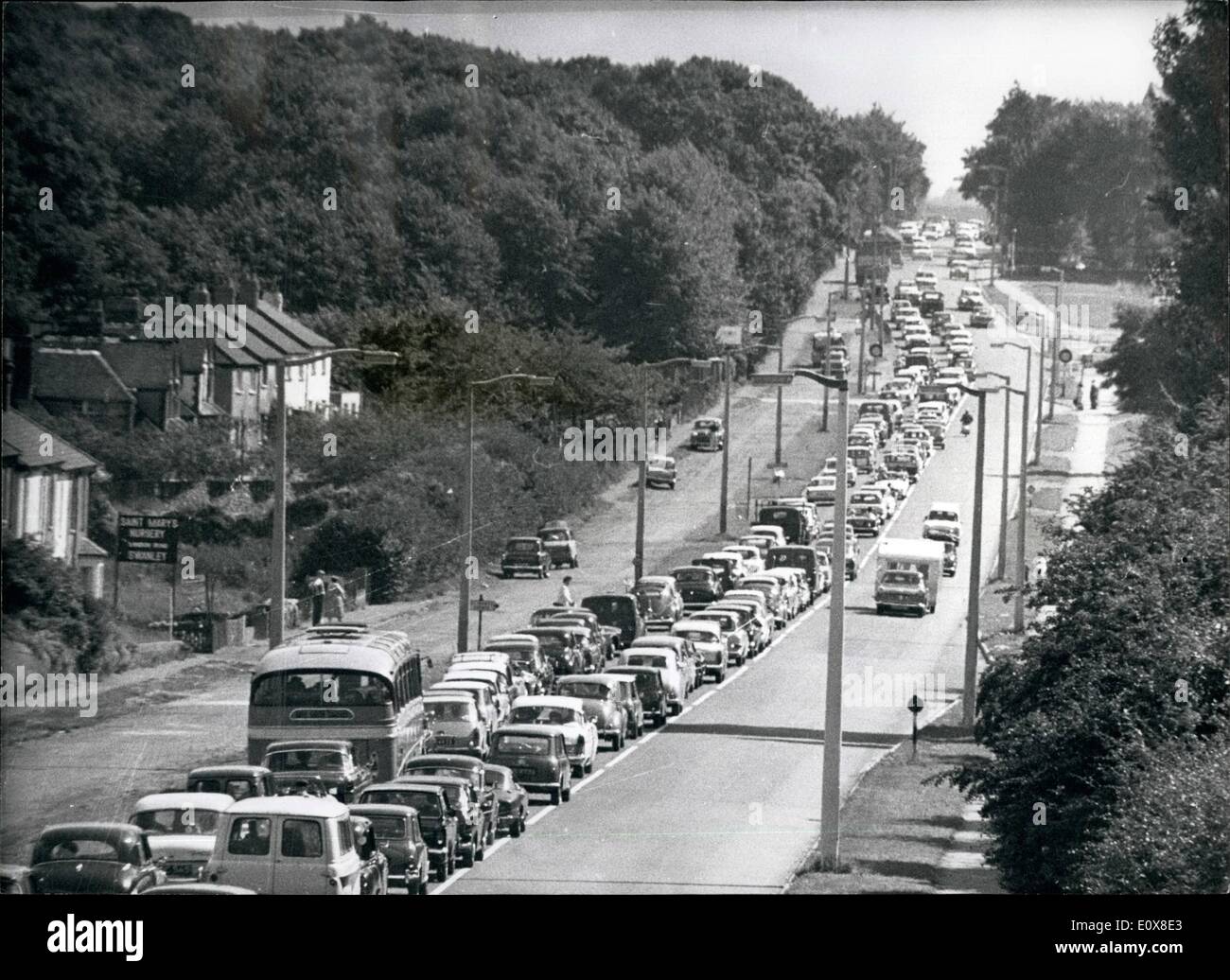 Aug. 08, 1965 - The Big Holiday Jam on The  As Traffic Heads For the Coast and  Batch Motor Racing Curcuit: On the 120 London to Maidstone road this morning their was a queue of double- banked holiday traffic 12, miles long, most of them heading for the Brands Natch Motor racing curcuit, and the rest to the coast, on this first late August Bank Holiday Monday. Picture Shows: A part of the 12, miles queue on the A20 London to Maidstone road this morning, note the 50, mile an-hour sign on the side of the road. Stock Photo