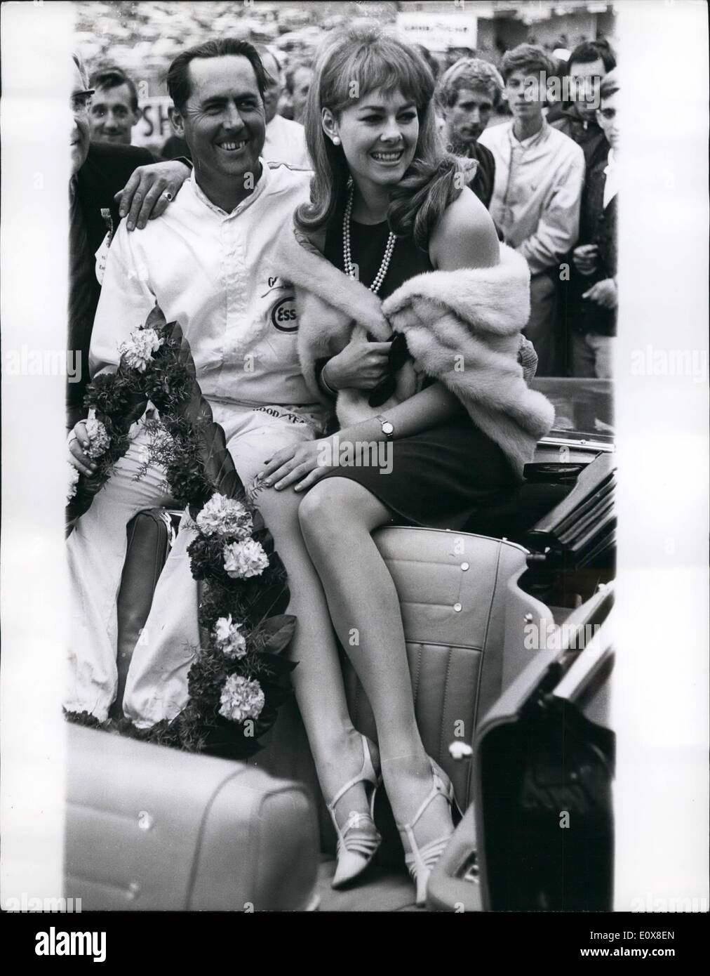 Aug. 08, 1965 - Sitting Pretty: Ann Sidney, the reigning ''Miss World'', climbed aboard Ford Mustang car yesterday, when presenting a victor's garland to Brabham, who had just won the Ilford Trophy saloon car race at Brand's Hatch. Stock Photo