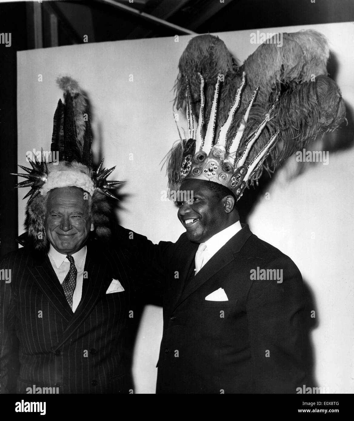 LORD BALFOUR of Inchyne and the High Commissioner of Trinidad and Tobago try on hats before Mardi Gras Carnival in Port of Spain Stock Photo