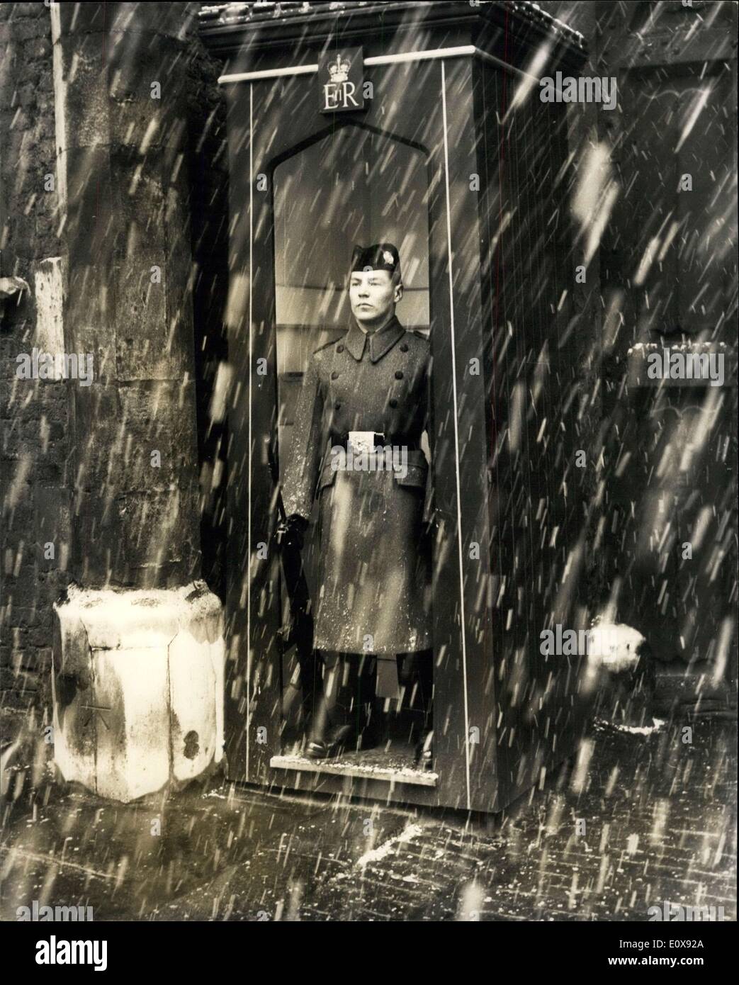 Nov. 22, 1965 - London Gets Its First Snowfall The Sentry Takes Cover In His Sentry-Box. Photo shows This sentry of the 1st Battalion The Cameronians on guard duty at St. Jame's Palace, makes full use of his sentry box in today's snow showers. Stock Photo