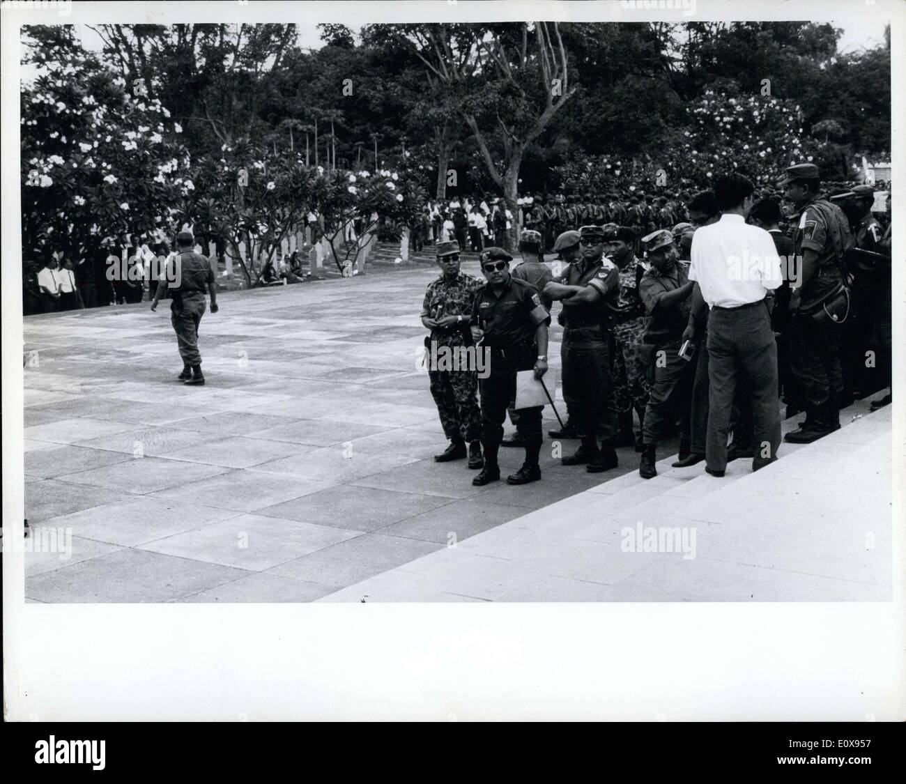 Oct. 05, 1965 - Army Chief of Staff, Maj. Gen. Suharto (left) in jungle suit - and Brig. Gen Sabur, head of Tjakabirawa (Sukarno's body guard unit) at the funeral for 6 generals killed in aborted red coup, Djakarta Indonesia. Sabur, Suakrono's Chief Body Guard ousted by Suharto. Stock Photo