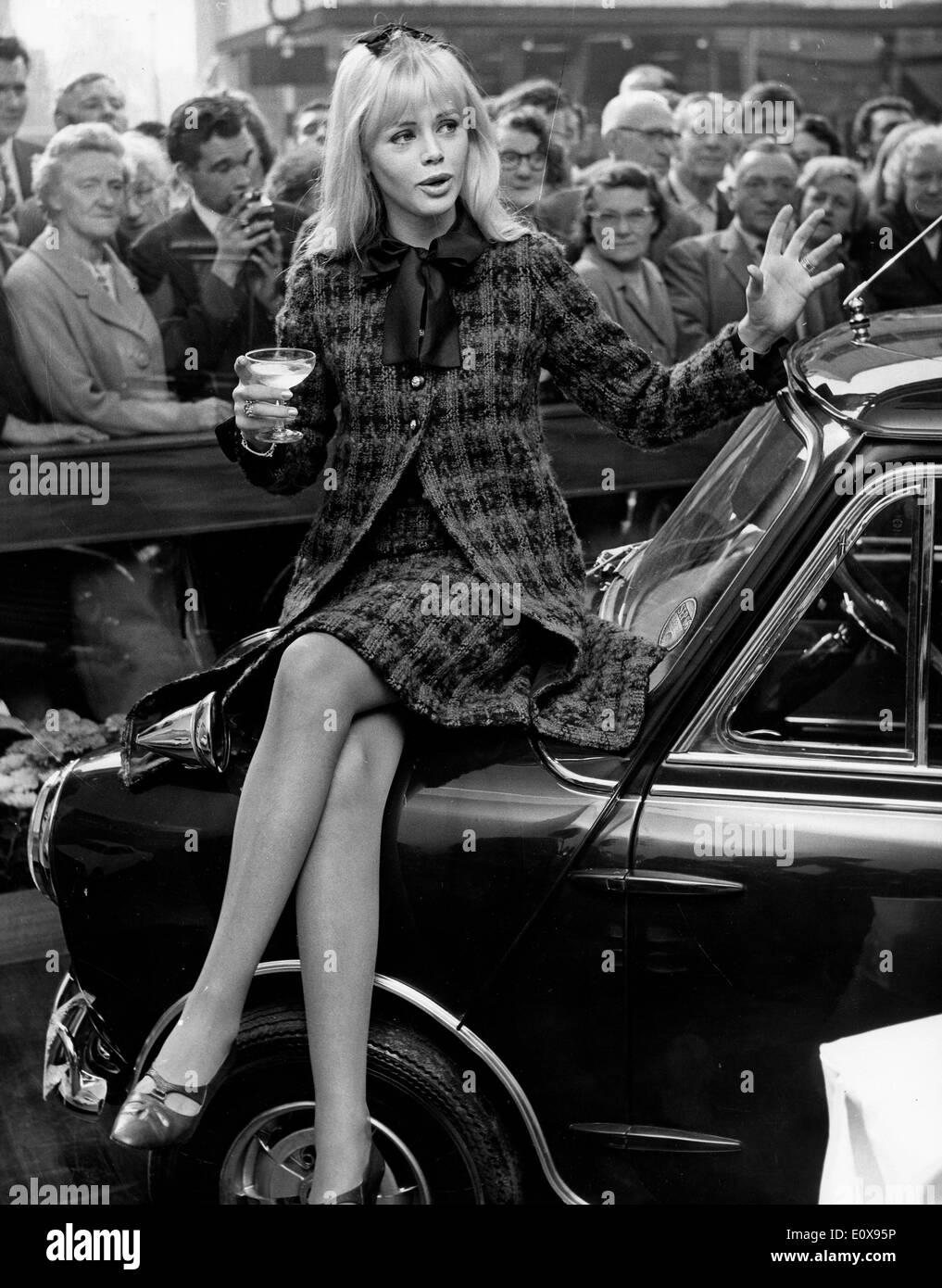 Actress Britt Ekland sitting on her new mini car Stock Photo