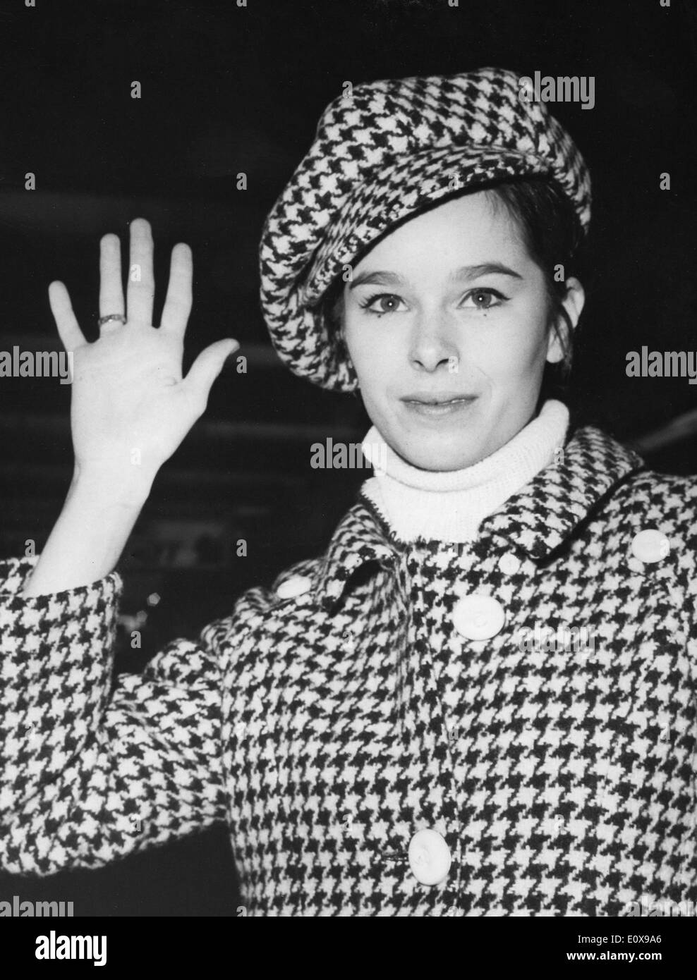 Dec. 7, 1965 - Paris, France - Ballet dancer GERALDINE CHAPLIN wearing a checkered outfit prepares to board a plane at Orly Airport to New York, for the premiere of the film, 'Doctor Zhivago.' Stock Photo