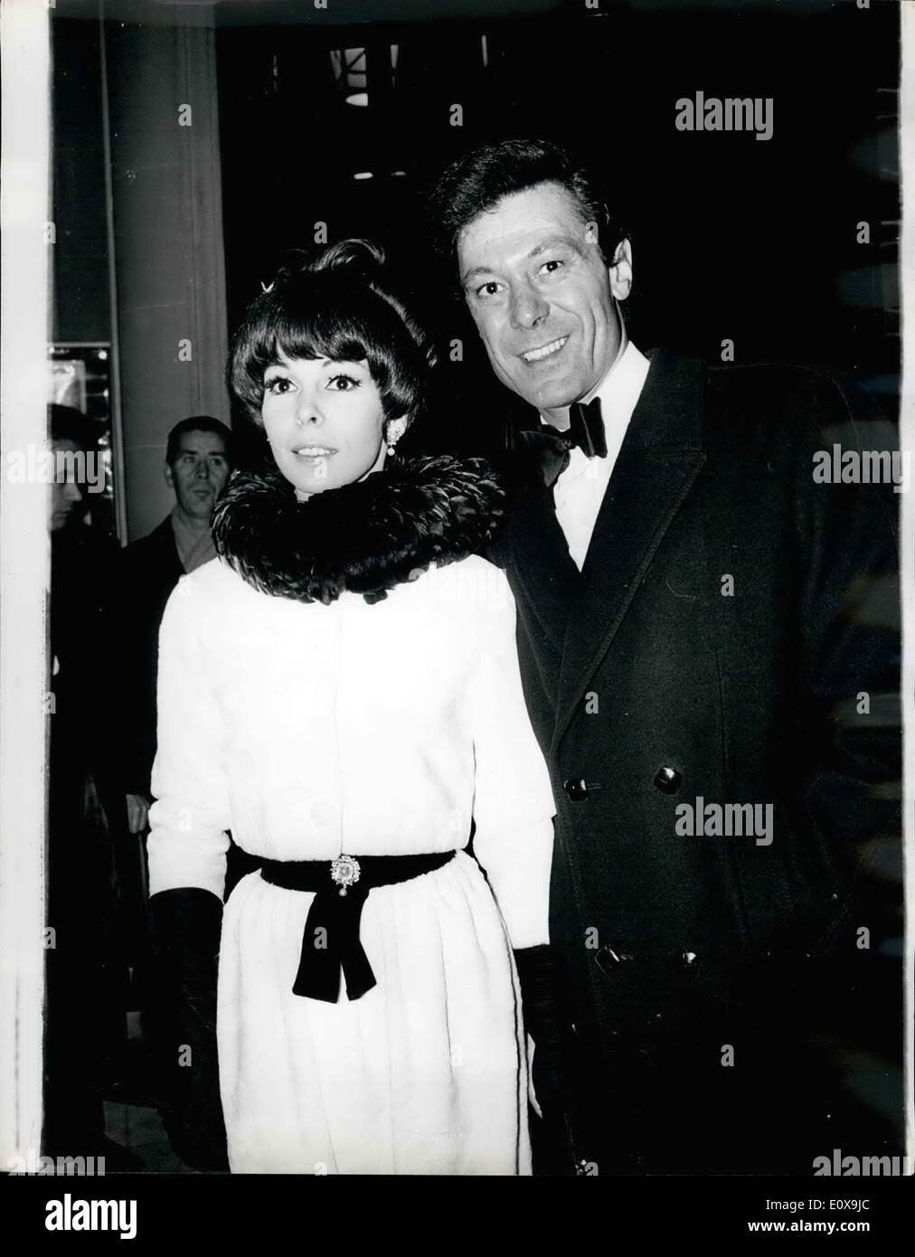 Dec. 12, 1965 - 3.12.65 First Night of ''Hello Dolly''. Photo shows Lionel Blair, with partner in feather collar, arriving at the Drury Lane Theatre left night, for the first night of the musical ''Hello Dolly' Stock Photo