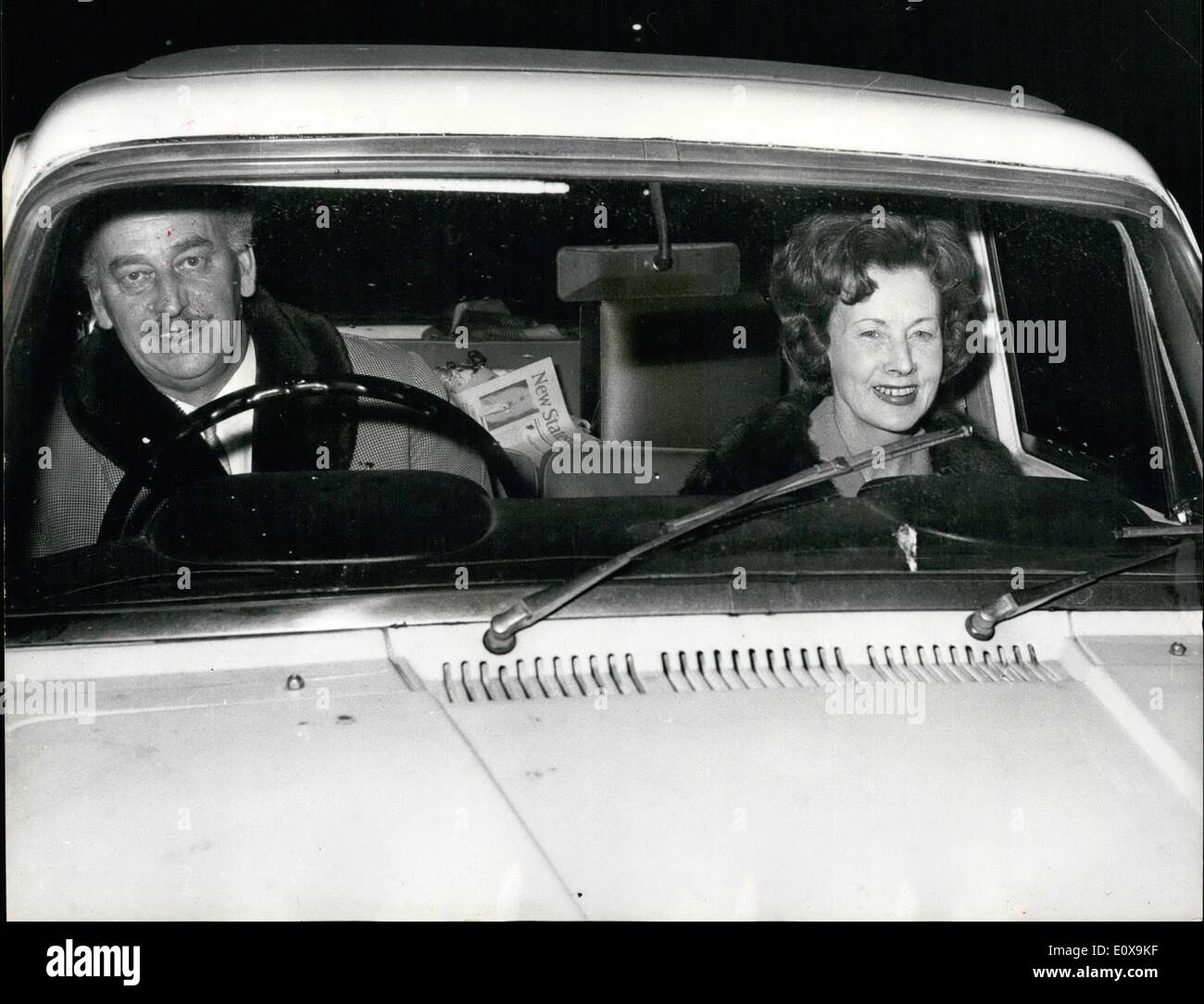 Dec. 12, 1965 - Mrs. Barbara castle is minister of transport : Mrs. Barbara castle, 54, has been appointed minister of transport in the prime minister's first cabinet reshuffle. Mrs. Castle, who does not dirv, is the first woman transport minister, and takes the place of Mr. Tom Fraser. Photo shows Mrs .Barbara Castle is driven from the house of commons last night by her husband, ted. Stock Photo