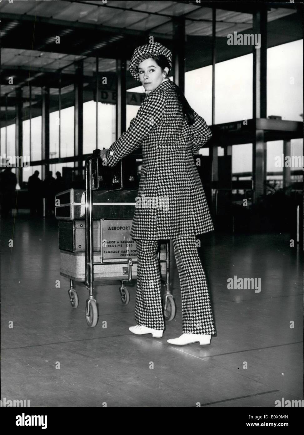 Dec. 12, 1965 - Off to new york : Geraldine Chaplin, charlie chaplain's actress laughter, left for new york this morning, she will attend the world premiere of the film ''Doctor Zhivago'', based can the famous pastenak's novel in which she plays the role of Zhivago's wife opposite to cram Sharif. photo shows Geraldine Chaplin wearing a checkered travel outfit and a ''Kid'' cap picture at Orly airport pricy to coarsening the plane. Stock Photo