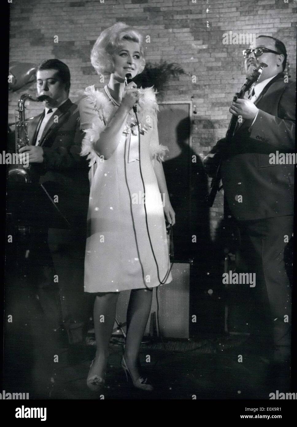 Oct. 10, 1965 - Marika Zahn-Kilius: appeared at the roof garden of the ''Henninger'' Tower in Frankfurt. She wanted to prove that she is able to sing, after there had been ''made so many rows'' last year because of two records of her. Marika Zahn-Kilius with the band. Stock Photo