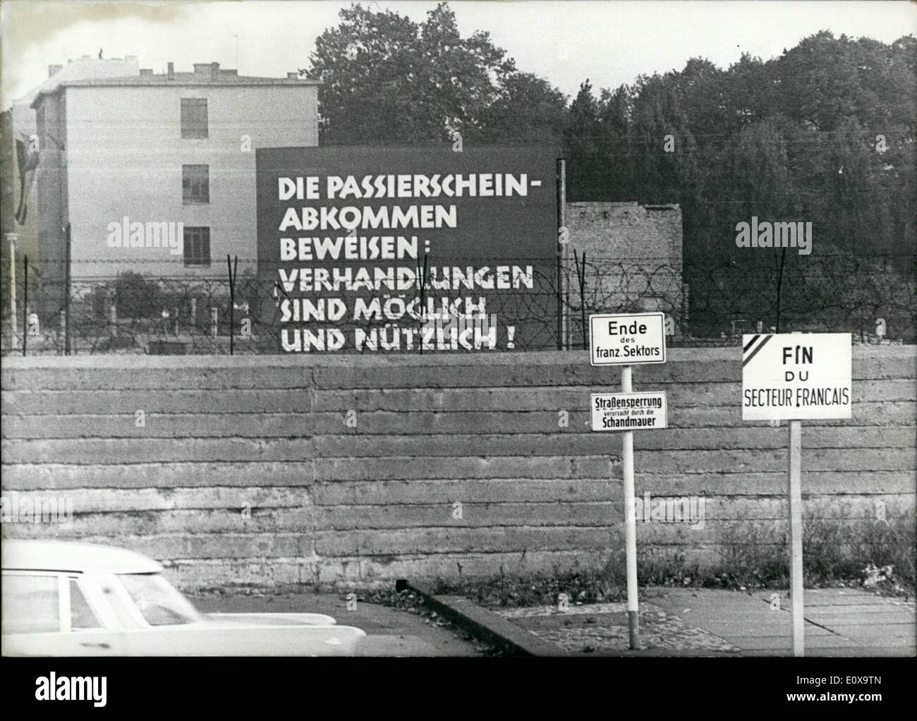 Oct. 10, 1965 - '' Shall this be a joke?.: Ask the inhabitants and visitors of West-Berlin who see this placard on the East side of the Bernauer street, which pillories discussions between East and West as possible and useful. Either are they not up-to-date behind the barbed-wire or perhaps beforehand; but it might not be right that the East-Berlin authorities only forgot to put aside this most promising table after the stop of the permit-discussions. Stock Photo
