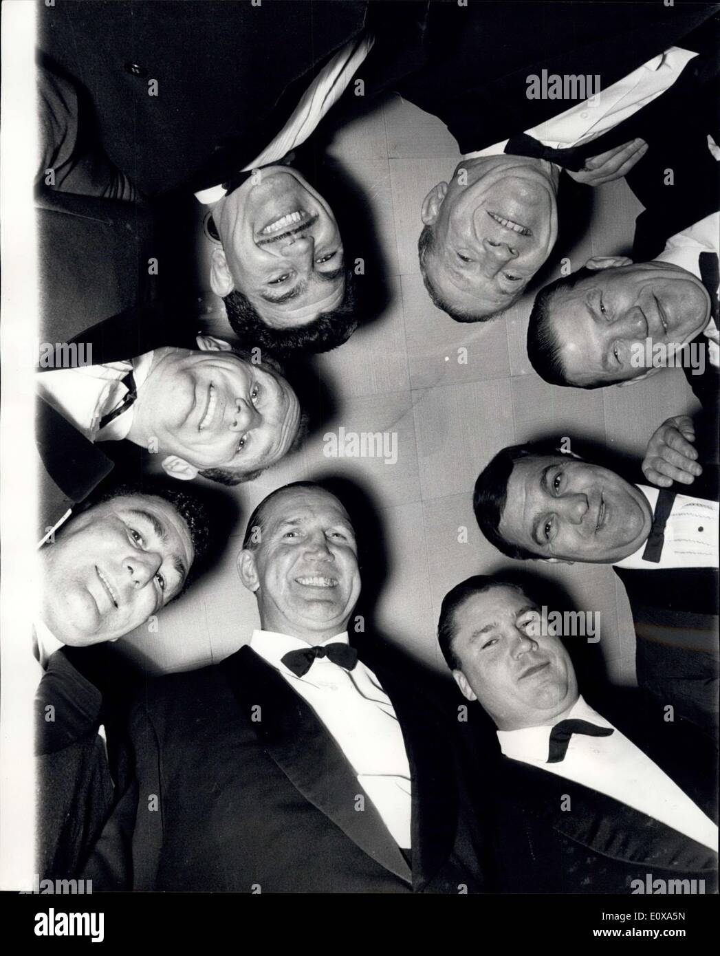 Nov. 02, 1965 - A Circle of Champions.: Rocky Marciano, who was world heavyweight champion from 1952 to 1956, and retired undefeated after 49 fights - was last night presented with a silver plaque from the Anglo-American Sporting Club. He was guest of honour at the club's dinner at the London Hilton, and some of Britain's best heavyweights were there to pay tribute to him. Photo shows A circle of champions last night Stock Photo