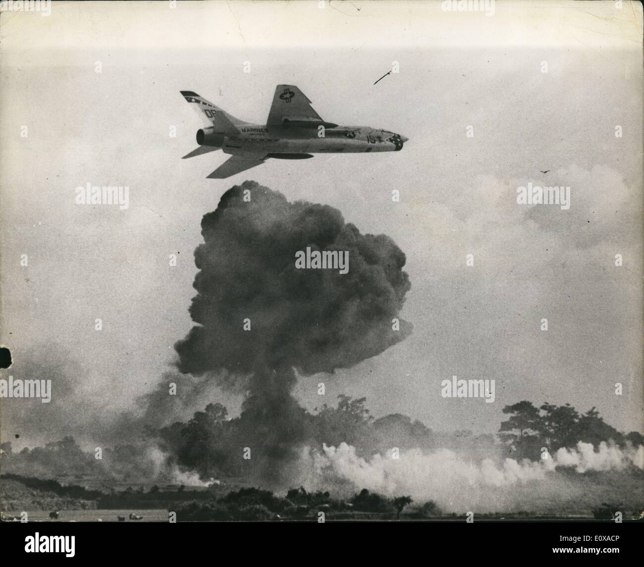 Jan. 01, 1966 - The war in Vietnam: Winging past a bomb explosion from another Crusader Jet, a U.S. Marine Fighter Squadron, All-weather (Vmfaw) -312 plane goes after the viet Cong who were dropping mortar fire on the landing Zones where two companies of hell-marines were landed. The shape of the 'mushroom' resembles the pattern of the Hiroshima atom bomb explosion in Japan during world war 11. Stock Photo