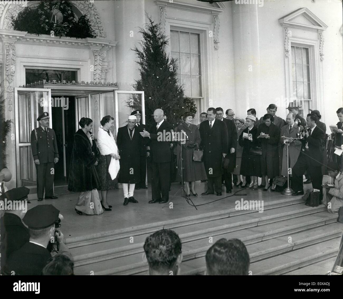 Jan. 01, 1966 - Mrs. Indira Gandhi Becomes India's First Woman Prime Minister: Photo shows (L. to R.) Mrs. Indira Gandhi, (daughter of Mr. Nehru) Mrs. Mamie Eisenhower, Mr. Nehru and Presidents Eisenhower, seen as they pose for pictures in front of the White House in Washington. Stock Photo