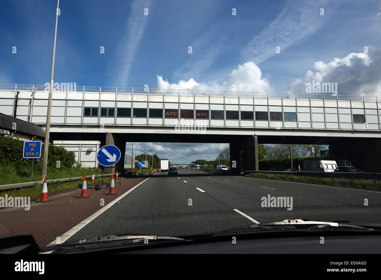 driving under charnock richard services motorway service station bridge M6 Motorway England UK Stock Photo