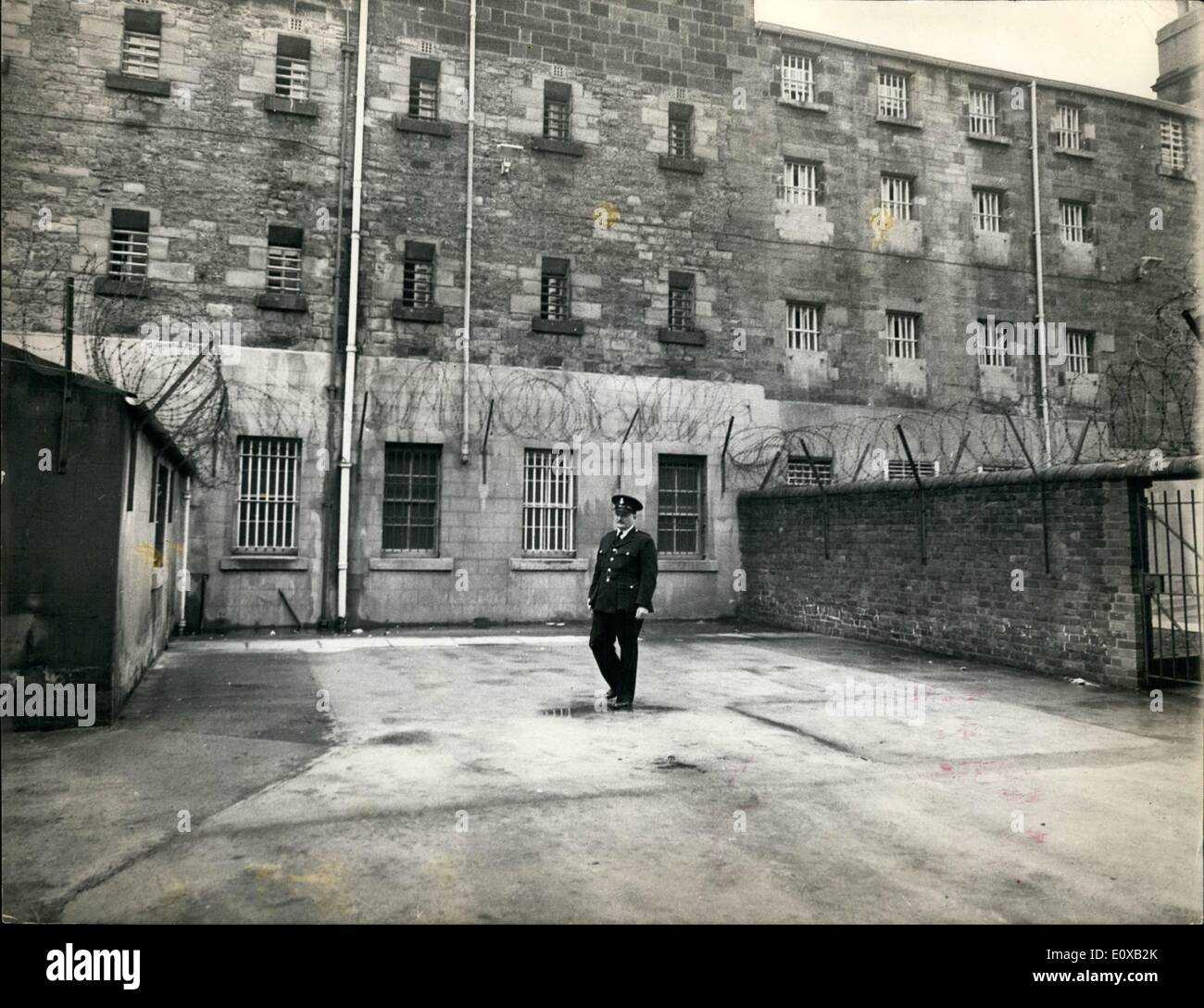 Jan. 01, 1966 - Barbed Wire Walk.: Barbed wire is fixed along walls and to the roof of a building in the exercise yard for prisoners under maximum security at Durham Gaol. The yard is 15-yards by 13-yards. Stock Photo