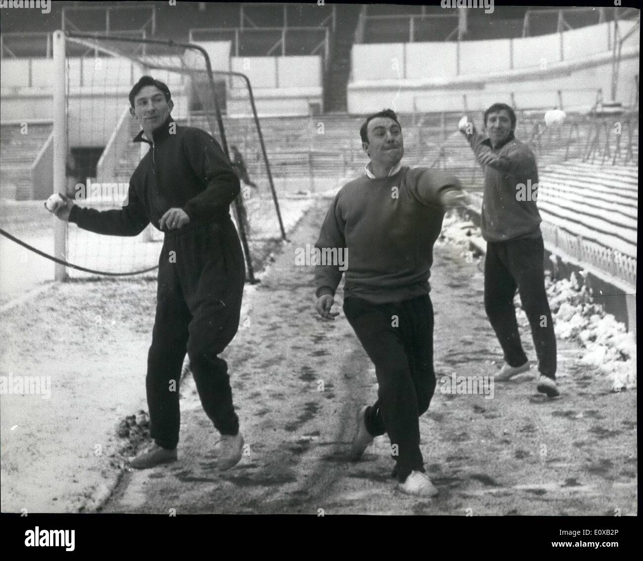 Jan. 01, 1966 - Jimmy Greaves Starts Light Training: Jimmy Greaves this morning reports to White Hart Lane to start light training - for his first football since going down with jaundice ten weeks ago. Photo Shows Spurs players (L. to R.): Bill Brown, Jimmy Greaves and Cliff Jones - indulge in a spot of snowballing - at White Hart Lane toady. Stock Photo