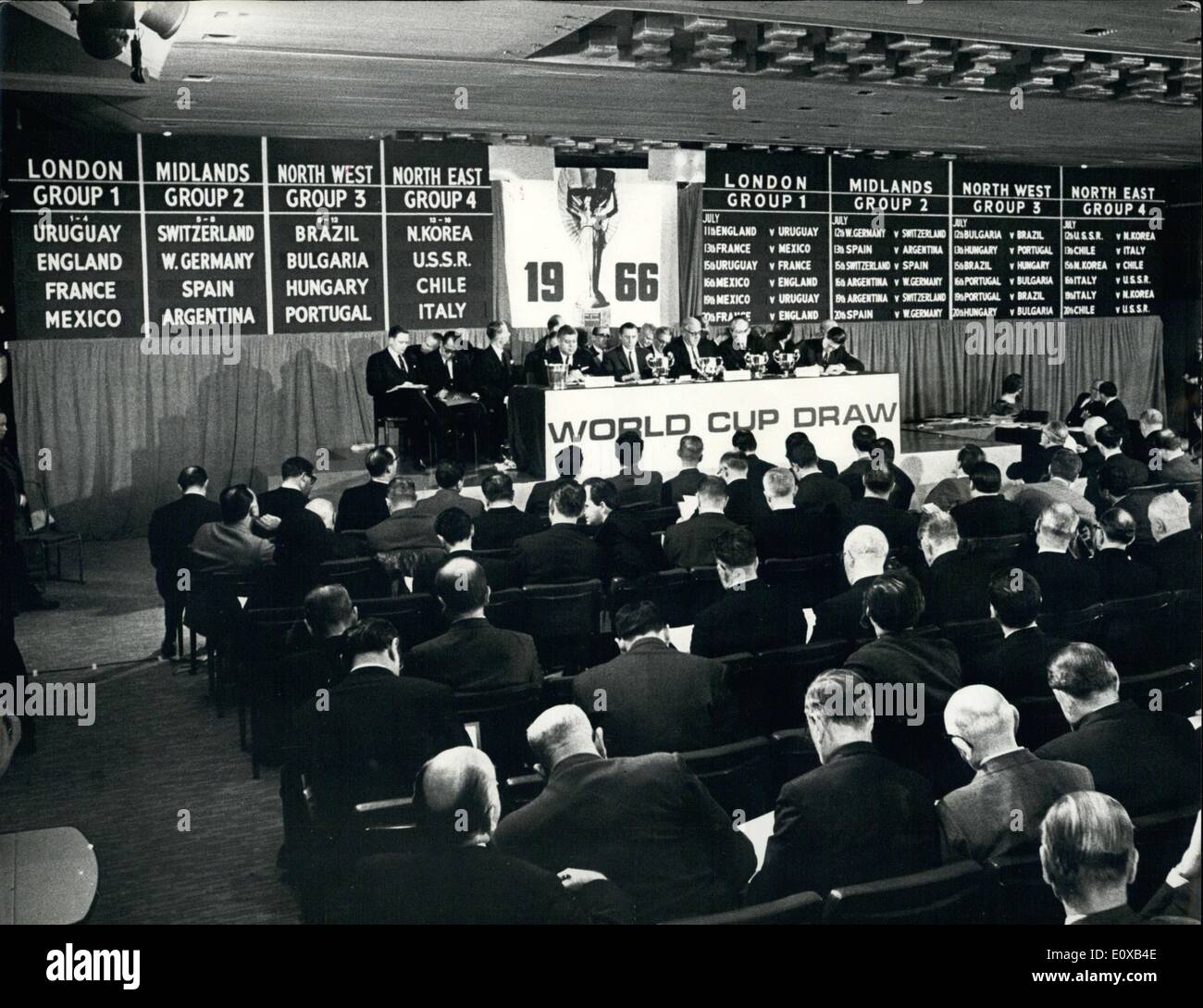 Jan. 07, 1966 - World Cup Soccer Draw - The draw for the World Cup soccer final rounds, to be played in England in July this year, was made yesterday (Jan 6) at the Royal Garden Hotel. Kensington, London. Sir Stanley Rous, President of the Federation of International Football Associations made the draw with other members of the FIFA Organising Committee. This was the scene at the end of the draw, showing at left the groupings of the sixteen finalist nations and, at right, how the teams are drawn to play each other in the four groupings. Left to Right at the front table are: S.L Stock Photo