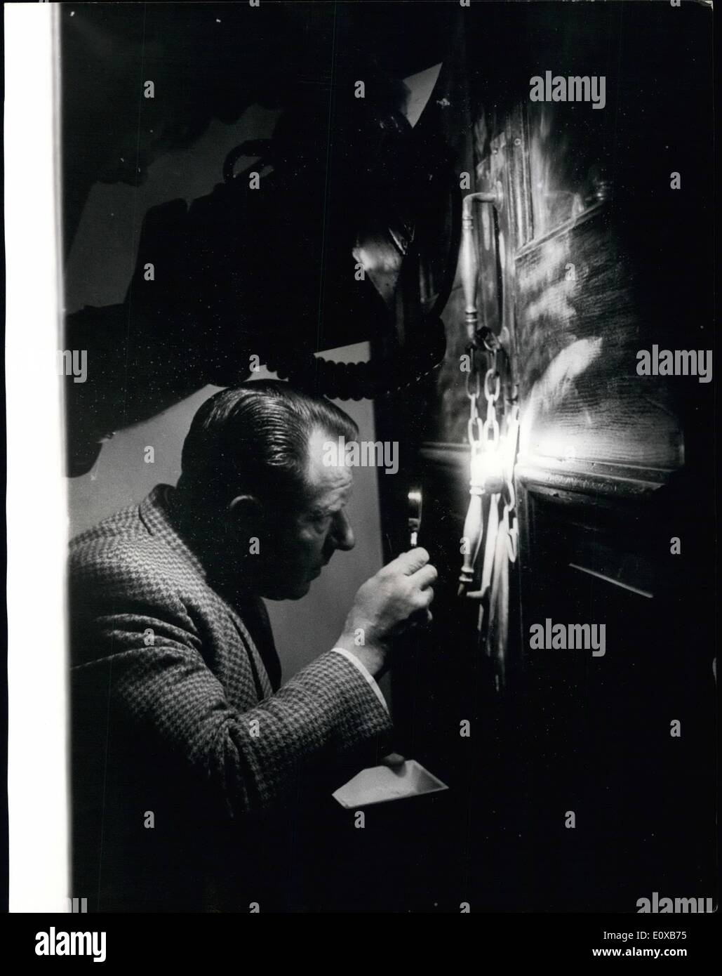 Mar. 03, 1966 - The World Cup is Stolen.: The famous World Cup was stolen yesterday from Central Hall, Westminster - where it was on exhibition in ''Stampex'' - Britain's national stamp exhibition. Photo shows Chief inspector Brian finger-printing the door where the thieves broke in. Stock Photo