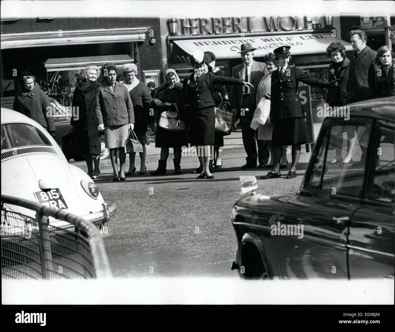Mar. 03, 1966 - Edna Goes On Point Duty. Teenager Edna Avivi went on point dut in a city street on Monday (March 28). Watched over by Constable William Murphy, Edna, and Israeli policewoman took charge of a busy junction in Manchester's Piccadilly. Edna is visiting Manchester with an Israeli Government sponsored exhibition, designed to promote the sale of their products. After her stint on point duty she said: ''It was very interesting, and people were have been a shortest, a policewoman in Tel Aviv for the past seven months Stock Photo
