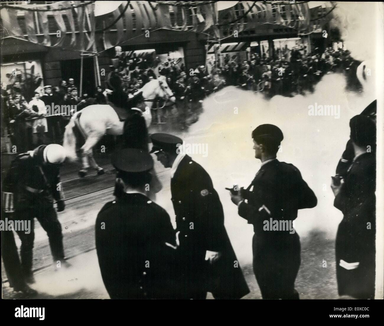 Mar. 03, 1966 - Crown Princess Beatrix Weds In Amsterdam. Crown Princess Beatrix of the Netherlands and Claus Von Amsberg were married today in Amsterdam. Anti-German demonstrators fought running battles with riot police in the streets of the city. Crowds of youths chanting ''Long Live the Republic'' and hurling smoke bombs, clashed with truncheon-wielding police as several points in the capital as the Princess drove to the Town Hall for the civil ceremony. Keystone Photo Shows: Police at the scene after a smoke bomb had been thrown by demonstrators, in Amsterdam today. Stock Photo