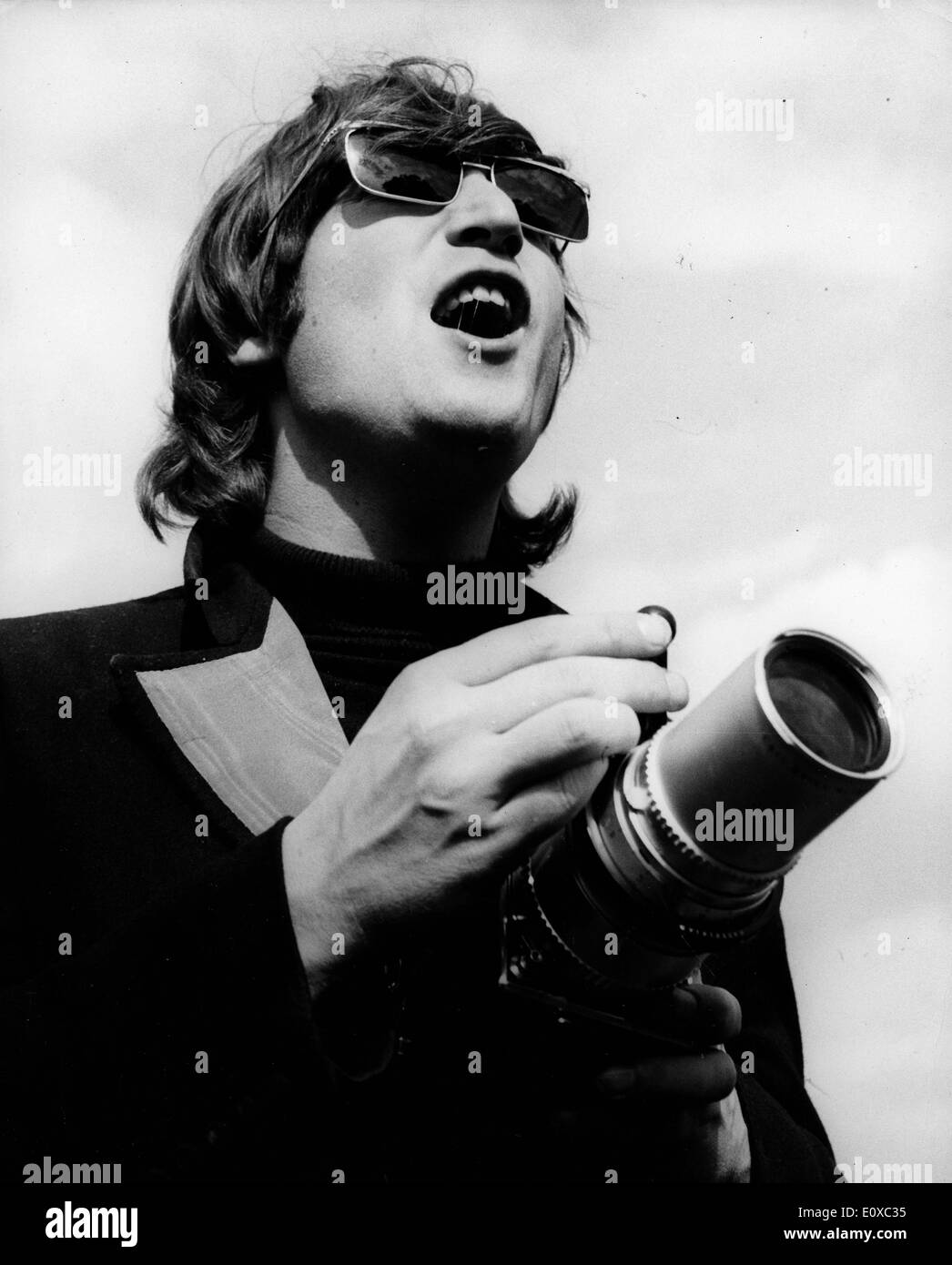 Beatle's singer John Lennon taking pictures Stock Photo