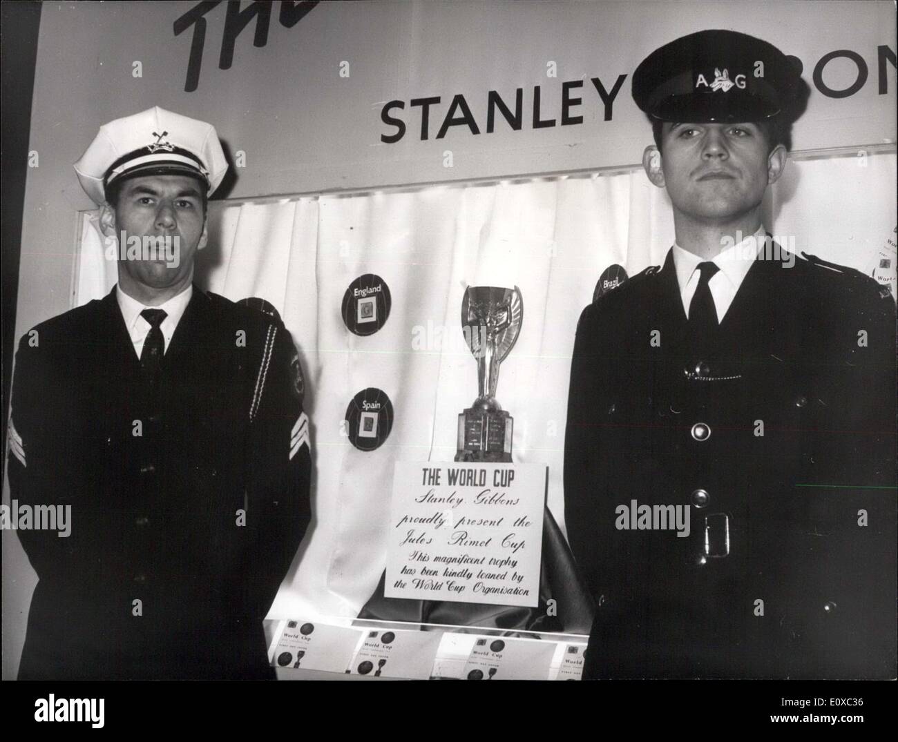 Mar. 18, 1966 - World Cup on Display at Stamp Exhibition.: ''Stampex'' - Britain's national stamp exhibition - opened today at Central Hall, Westminster. Theme of the exhibition is Sport- and on display is the famous Jules Rimet World Cup, which is insured for ?30,000. Photo shows Security guards with the World Cup - at Central Hall today. Stock Photo