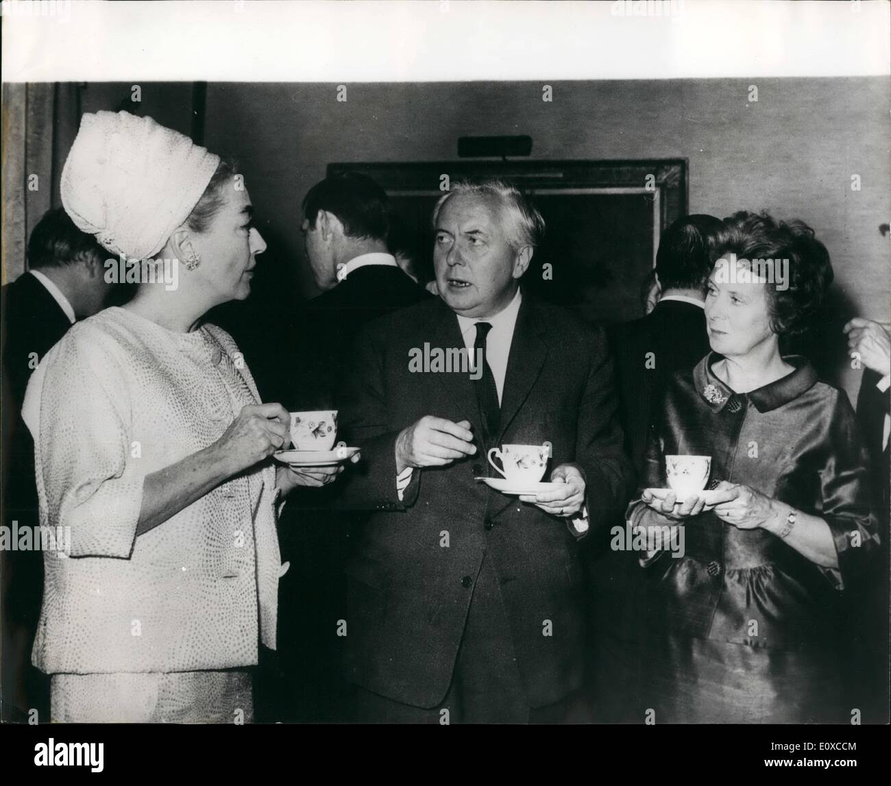 Apr. 04, 1966 - Premier meets Joan Crawford; Actress Joan Crawford and other leaders of Variety Club International - were yesterday invited to No. 10 Downing Street for afternoon tea, by the Prime Minister, Mr. Harold Wilson. Photo Shows The Prime Minister, Mr. Harold Wilson and Mrs. Wilson, chatting to Joan Crawford (left), over a cup of tea - at No. 10, Downing street yesterday. Stock Photo