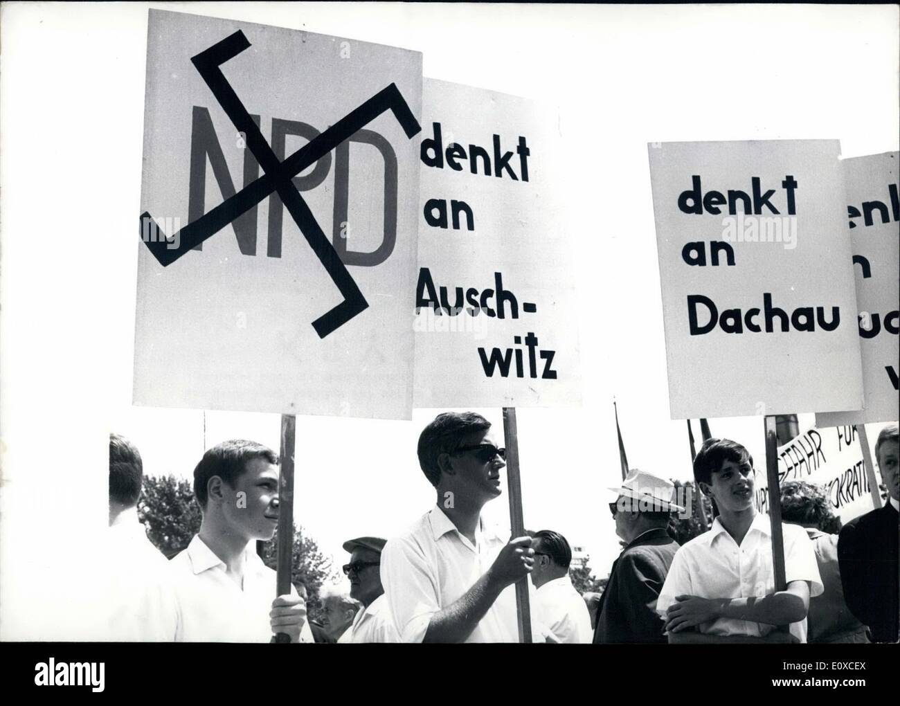 Jun. 06, 1966 - NDP-meeting in Karlsruhe: From Junbe 17th till June 19th, 1966 the Second Federal Party Meeting of the NPD (National Democratic party of Germany) takes place in Kerlsruhe inspite of extensive protest-actions of SPD (Social Democratic Party of Germany), the trade-union and the mubnicipal government of Karlshruhe. In opposition of 4000 NPD-members about 20000 members of the SPD and trade-union arrived Karlsruhe on June 17th in order to make demonstrations against the NPD-party-meeting. Photo shows Demonstrators with transparencies with paroles against the NPD. Stock Photo