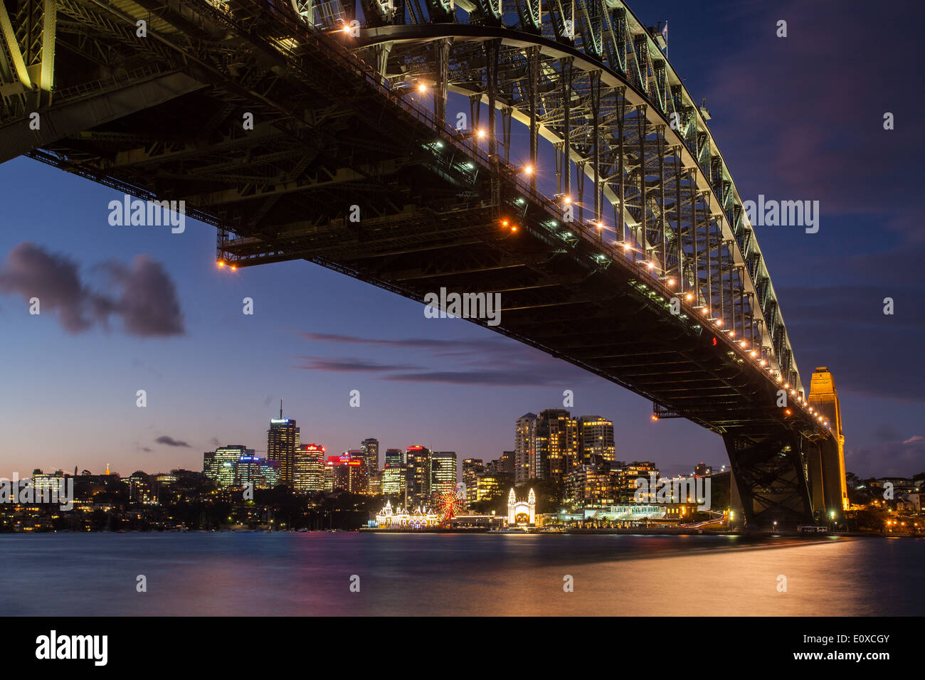Sydney Harbour Bridge and Luna Park at dusk in Sydney, Australia Stock Photo