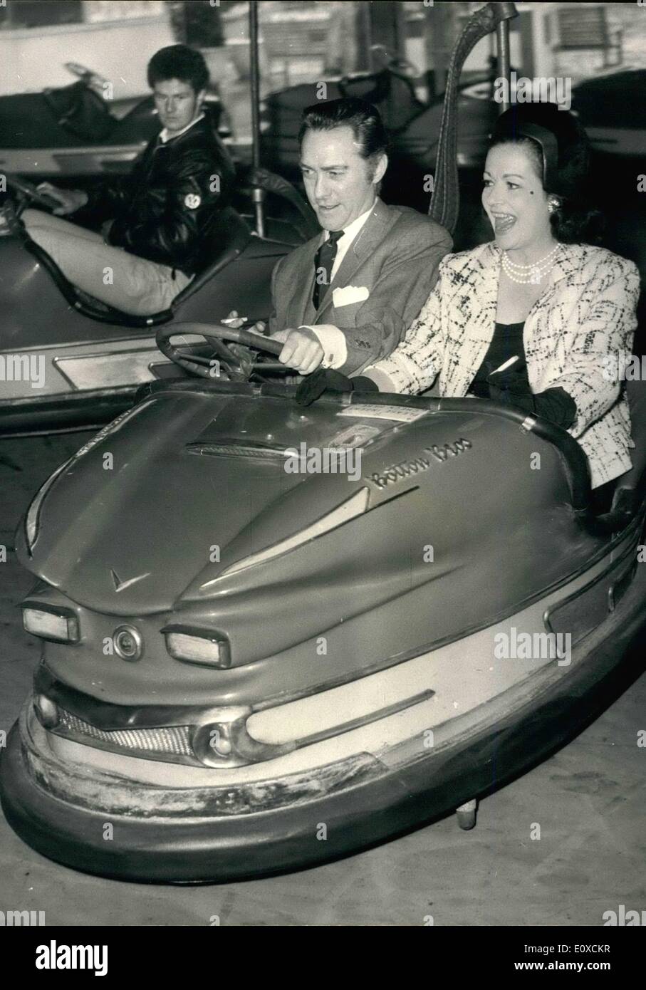 Apr. 04, 1966 - The opening of the Battersea Festival Gardens and Fun Fair: Actress Margaret Lockwood and actor Richard Tood, who play opposite each other in Oscar Wilde's ''An Ideal Husband'' at the Strand Theatre, were the quests of honour this afternoon at the opening of the Battersea Festival and Fun Fair. Photo Shows Margaret Lockwood and Richard Todd enter into the the holiday spirit as they take a ride on the dodgem cars at the fair today. Stock Photo