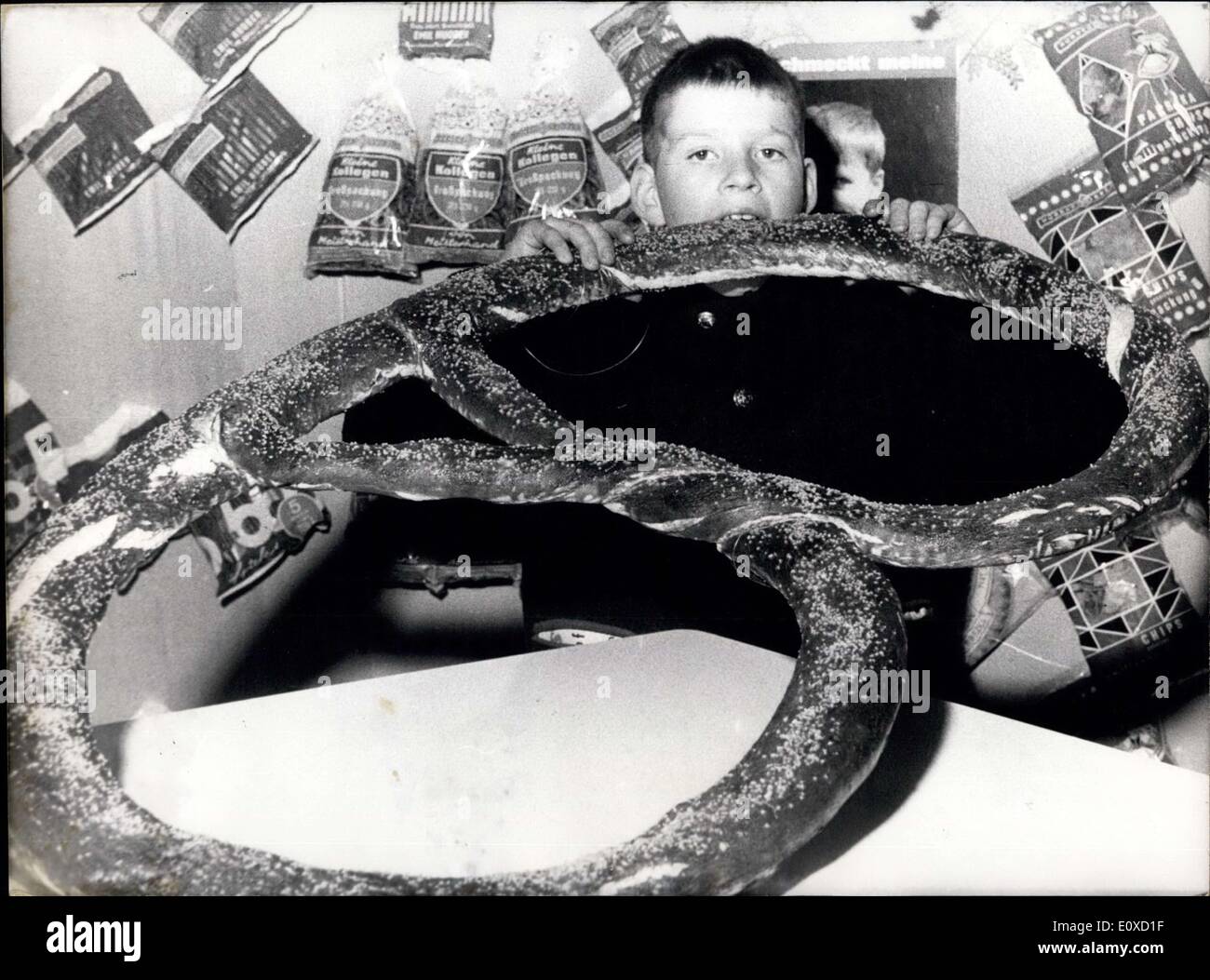 Apr. 16, 1966 - Ohh, that's fine; little Ulli is in raptures about this giant sweet pretzel. It is presented at the SUFA (Subwarenfachausstellung Exhbition of sweetmeats) which takes place from April 16th till April 20th in Cologne. Stock Photo