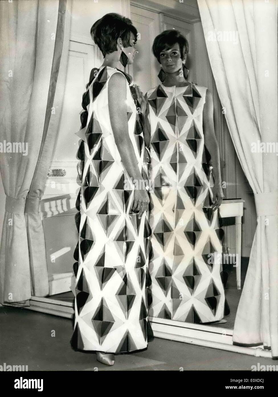 May 05, 1966 - Plastic Everywhere: Paris Dress ke HV contributed to the Europlastic show now g held in the French Capital. Photo shows Evening dress in Vinyl Polychrome designed by Philippe Vinet. Stock Photo