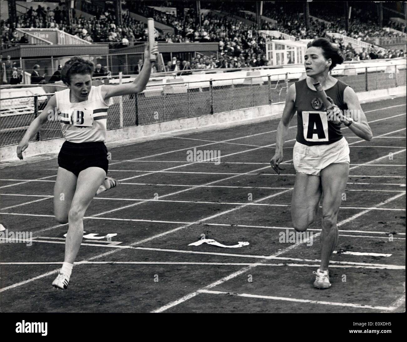 Jun. 18, 1966 - Britain wins 4 x 100 metres relay (Women): London: Britain's Jill Hall (Mitcham Athletic Club) ''B'' is pictured winning the 4 x 100 metres relay (Women) in 45.6 seconds from Russia's Vyera Popkova (A) during the second and final day of the Great Britain and Northern Ireland Versus Russia International Athletics match organised by the British Amateur Athletic Board at the White City Stadium today, June 18. Stock Photo