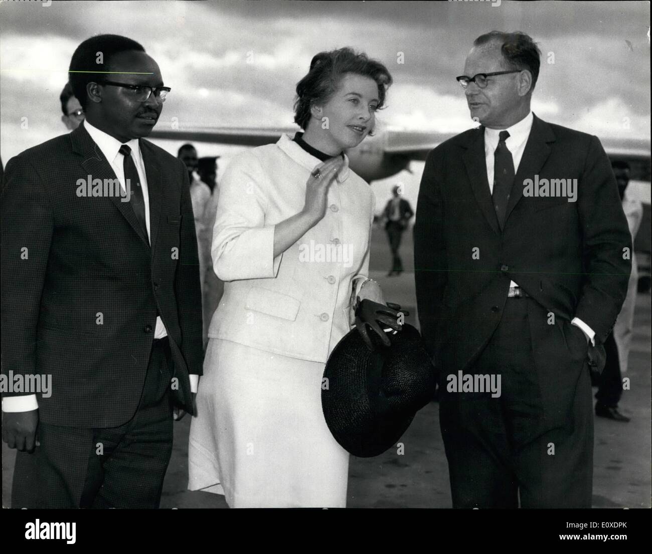 May 05, 1966 - British Woman envoy arrives in Kenya: Mrs. Judith Hart, Minister of State at the Commonwealth Relations Office, flew into Nairobi Airport today on a tough mission to Zambia. Britain's Prime Minister has given her the task of patching up Britain's swiftly worsening relations with the Zambian President, Kenneth Kaunda. Photo shows Mrs. Judith Hart (centre) pictured with Mr. Kipnge, Under Secretary at the Kenya Foreign Office (left) and Mr. Edward Beck, the British High Commissioner in Kenya (right) who met her on arrival at Nairobi Airport today. Stock Photo