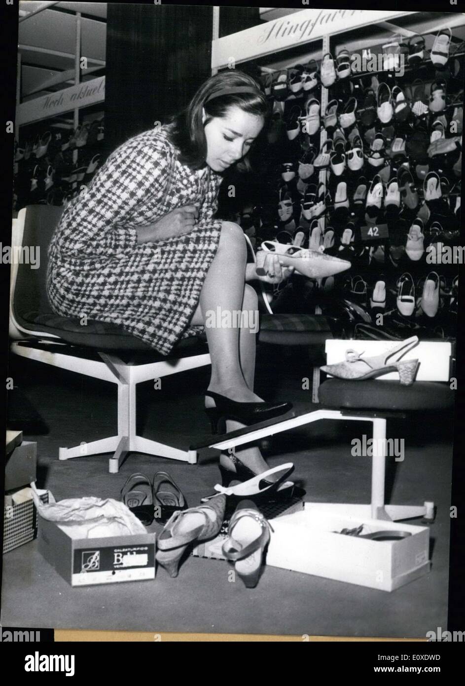 Jun. 25, 1966 - Berlin Actress Monika Peitsch has a soft spot for shoes. Wherever the actress goes she has to check out the shoe stores. Her shoe rack at home is already overfilled! She is pictured in Berlin, where she is filming a new Edgar-Wallace Film. Of course she is shoe shopping on her free time. Stock Photo