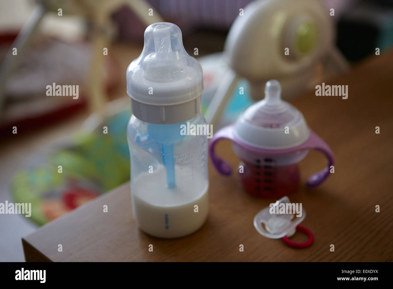 babys bottle drink cup and dummy Stock Photo