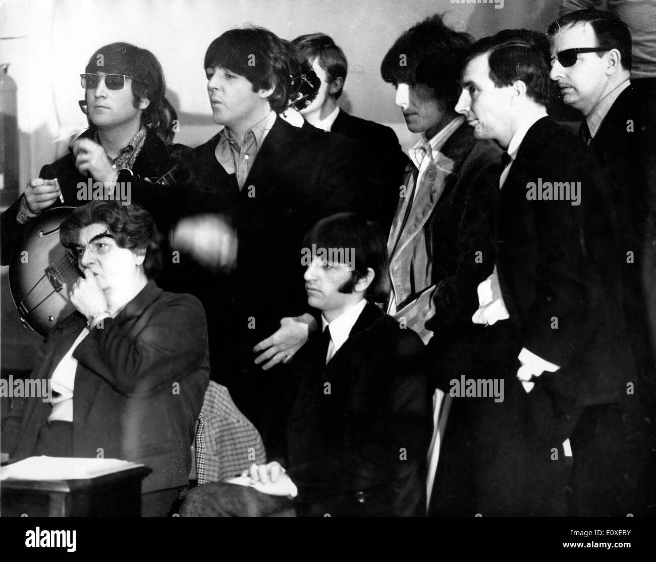 The Beatles watch a recording at EMI Studios Stock Photo