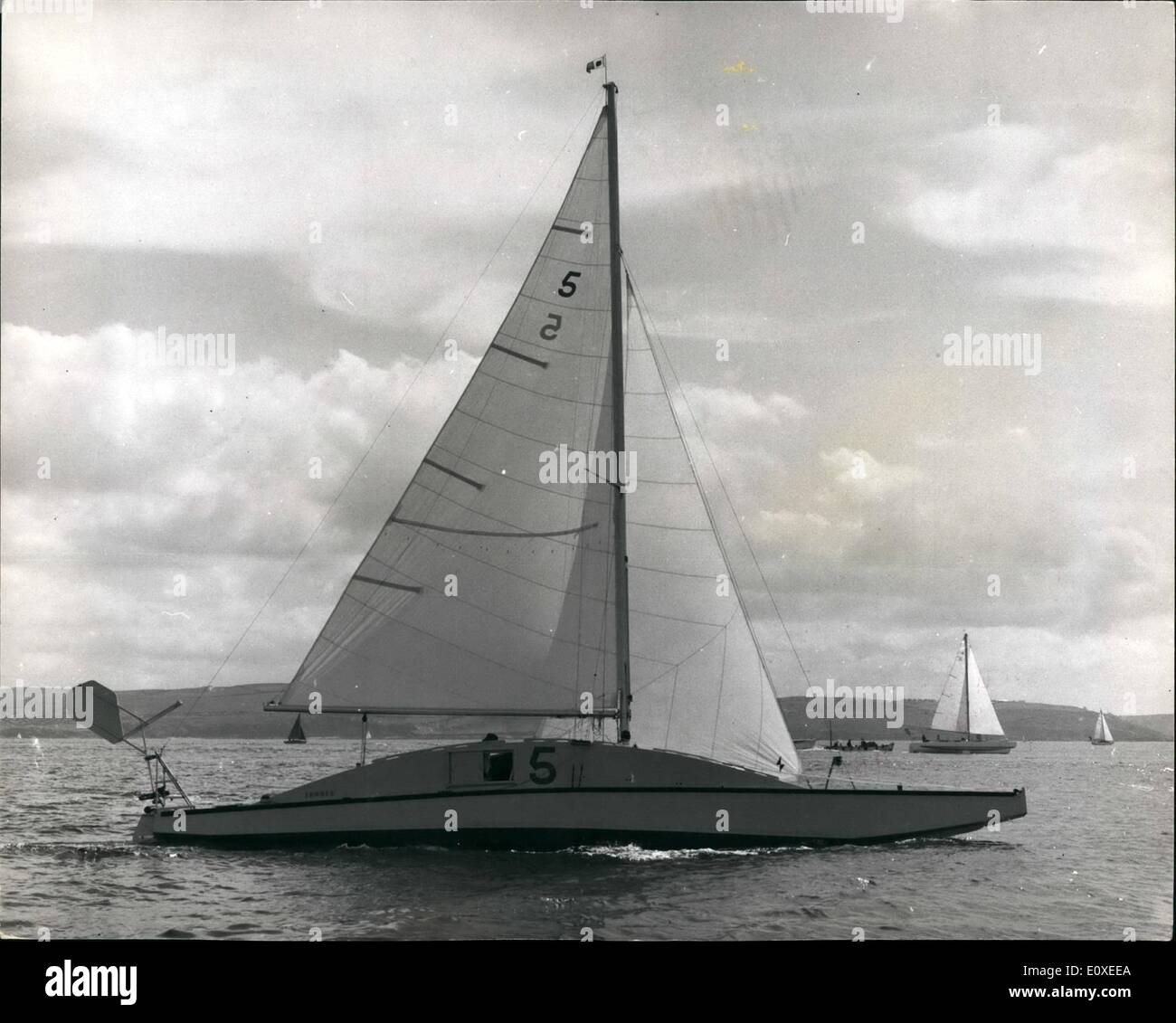 Jul. 07, 1966 - The first two handed round Britain sailing race set off from Plymouth: Out from Plymouth yesterday sailed 16 vessels bound on a 2,000 mile trip around Britain. They set off in the first two handed Round Britain Sailing Race for a trophy and a prize of &pound;1,000. Some of the boats have been specially designed for this particular race. Photo shows The yacht ''Summer'' with a alongside hump on the deck is being sailed in the race by its owner Lieut-Col. Blondie Hasler, veteran of solo trans-Atlantic crossings and his wife Stock Photo