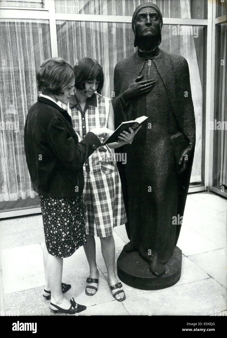 May 26, 1966 - These two women are searching in this book to find out which famous person this statue is supposed to represent. Stock Photo