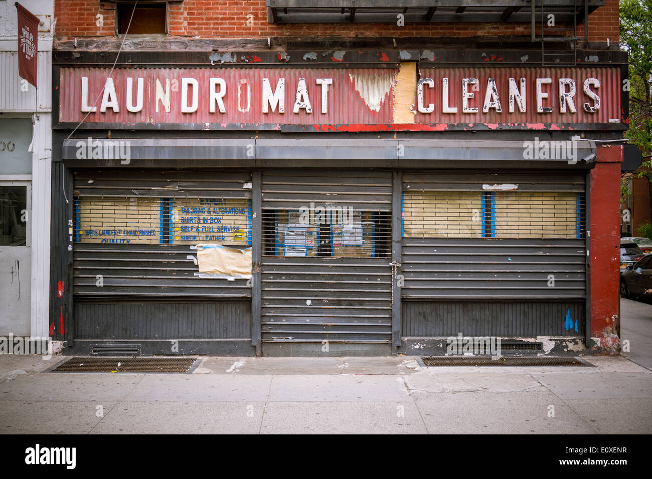 A closed laundromat is seen in the Chelsea neighborhood of New York on