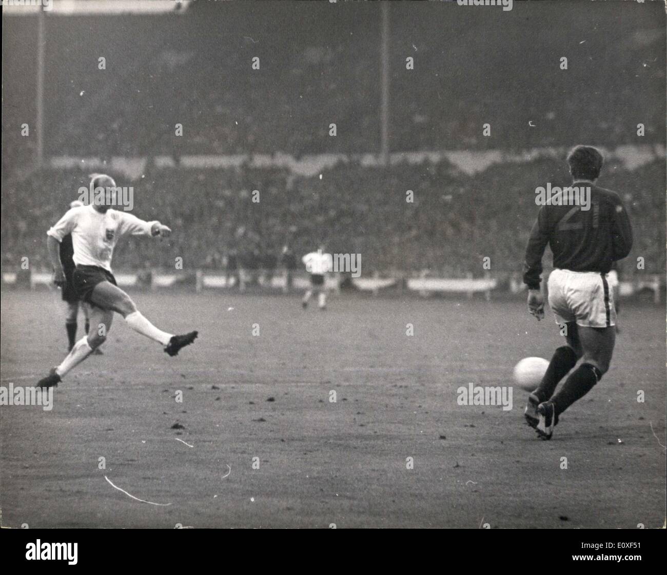 Jul. 27, 1966 - World Cup Football: England Vs. Portugal. Photo Shows England's second goal: Bobby Charlton lets go with a hefty right foot shot, to score England's second goal, as Portugal's Jose Carlos runs in to try and intercept - during last night's World Cup semi-final match at Wembley. England won 2-1. Stock Photo