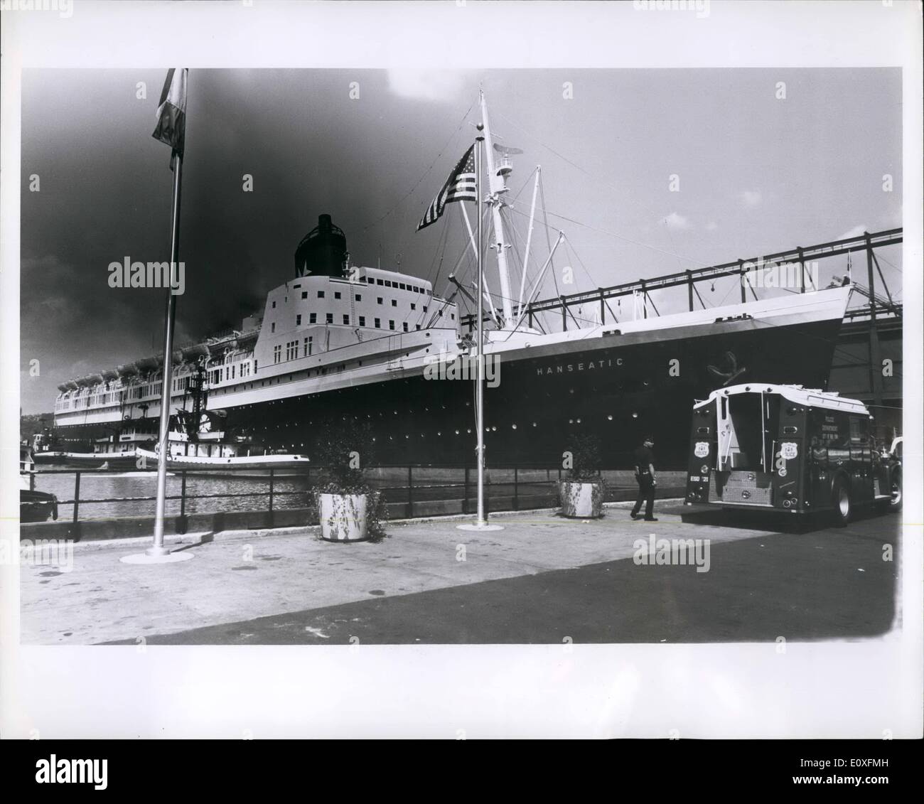 Sep. 09, 1966 - 30,000 ton German liner Hanseatic in five alarm fire at New York Hudson River Pier: Leaking diesel fuel caused fire injuring 7 firemen and causing great damage to vessel owned by Atlantik Line & Co. of Hamburg. It took 300 firemen and 50 apparatus to get control after 7 hours. Three city fire boats, several police helicopters and two Coast Guard vessels came to help but were not used. All the action was below deck. Foam was used extensively rather than water to avoid capsizing of the boat. There were only few passengers on board, were quickly evacuated, none injured Stock Photo