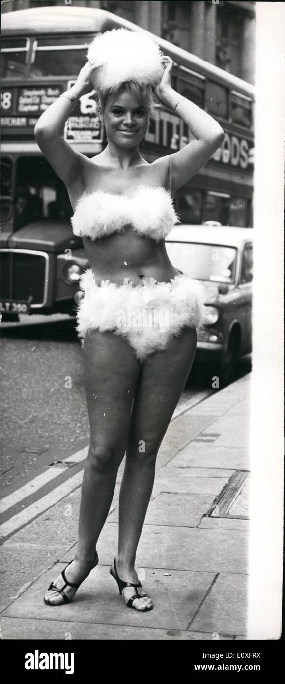 Nov. 11, 1966 - Annual Festival of Poultry Feath Hats: The Eight Annual Festival of Poultry Feather Hats - a preview to the International Poultry Show -was held today at the Cafe Royal - presenting some 100 hats, items of clothing etc, all made from poultry feathers by amateurs from all parts of the U.K. and Ireland. Photo shows Josephine Aberdein, of Harrow, wearing an all-turkey feather bikini, with matching hat made by Miss Jean Heald, of Euddersfield, outside the Cafe Royal today. Stock Photo