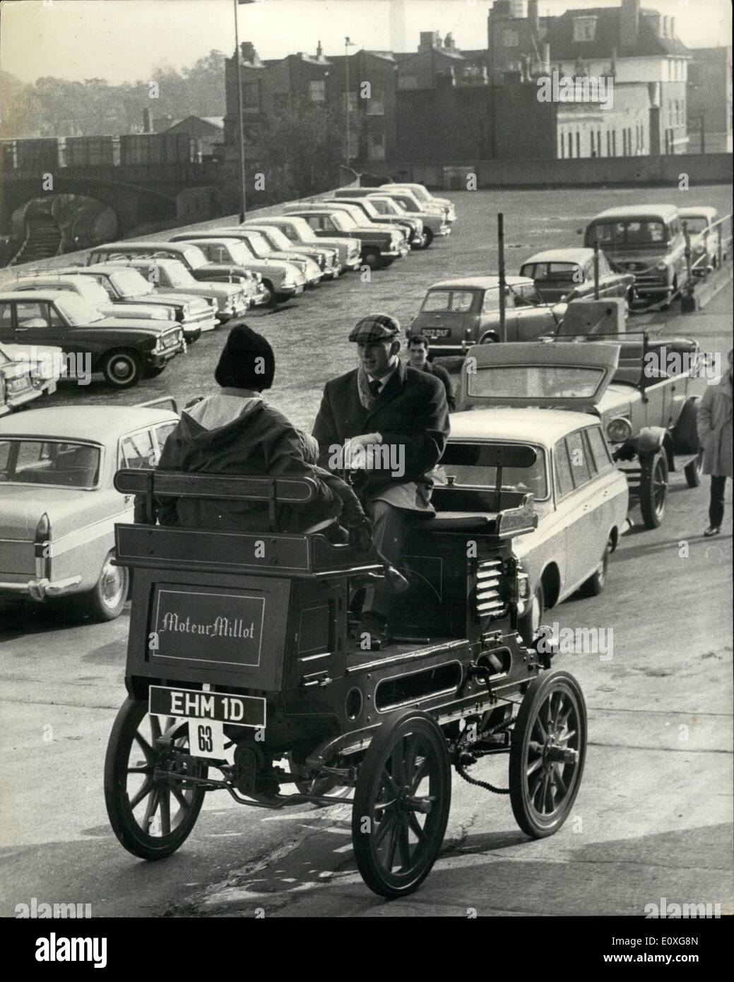 Nov. 11, 1966 - Vintage cars, etc, to be sold by auction; Early Bicycles, Vintage Motor Cycles, Engine Models, Horse drawn Vehicles, and Car Carriage Lamps and Motoring Mescellanea, and Veteran, Edwardian and vintage motor cars, will be sold by auction by Sotheby's at Earl's Court on Friday, November 4th. Photo Shows A Moteur Millot (approx. 1900 vintage) being driven into Earls Court today, by Allan Hancock, of Rex Place, Mayfair. He found it being used as a static motor on a farm in the South of France, brought it, and renovated it to its present excellent condition. Stock Photo